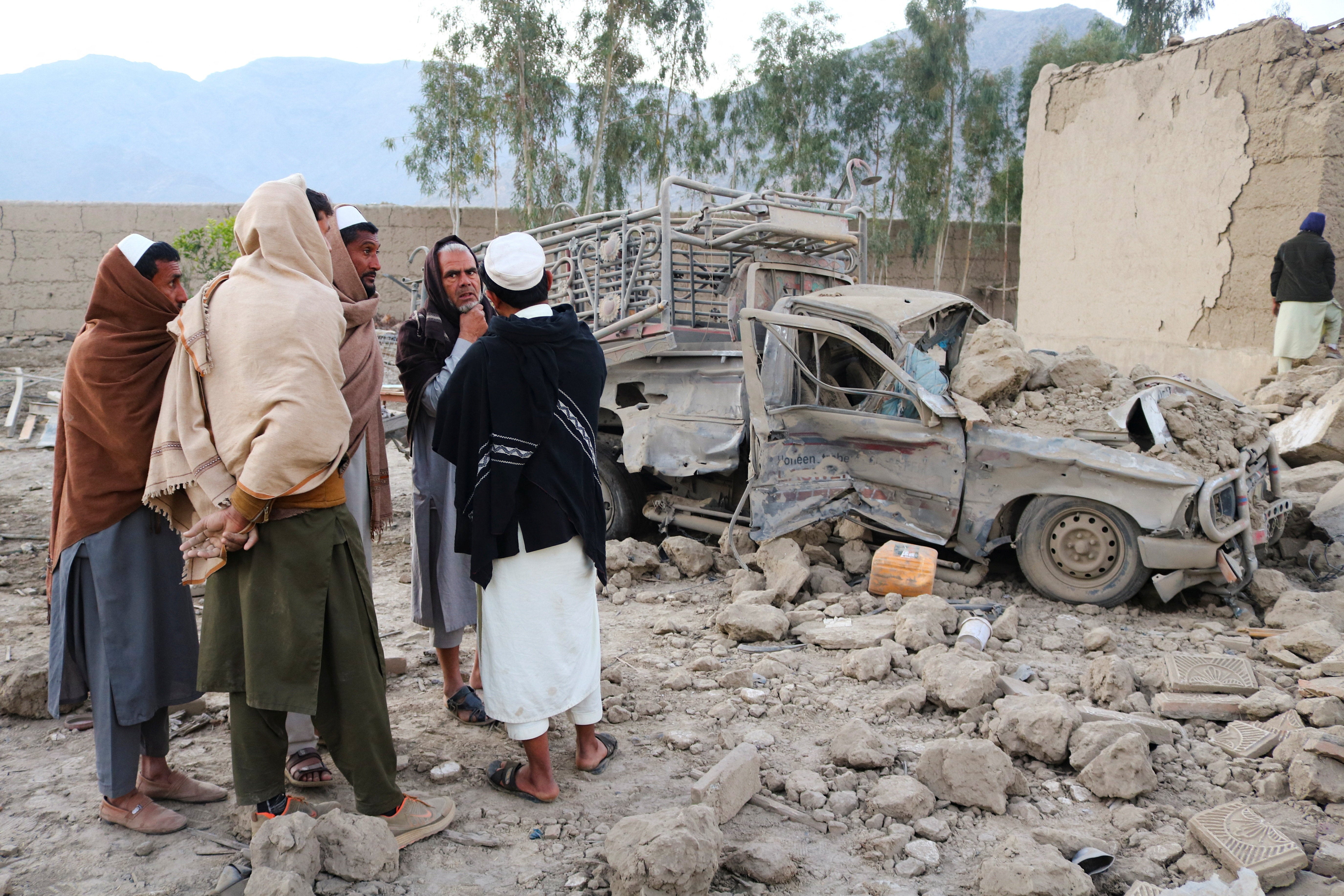 Residents gather at the site, followig the Pakistani airstrikes, in Bihsud district, Nangarhar province, Afghanistan, February 22, 2026. REUTERS/Stringer