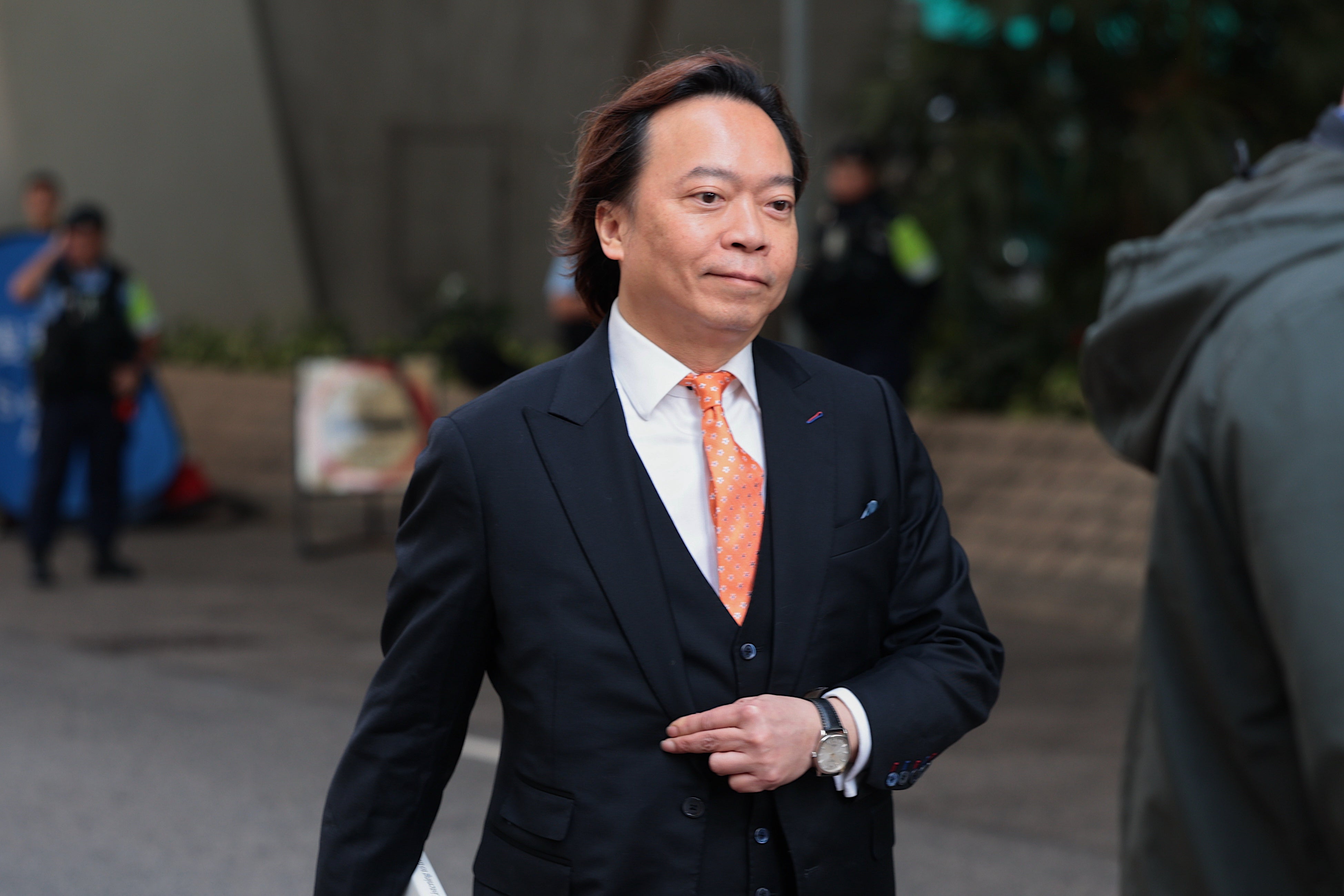 Pro-democracy activist Lawrence Lau Wai-chung arrives at the West Kowloon Law Courts Building ahead of the national security appeal cases, in Hong Kong