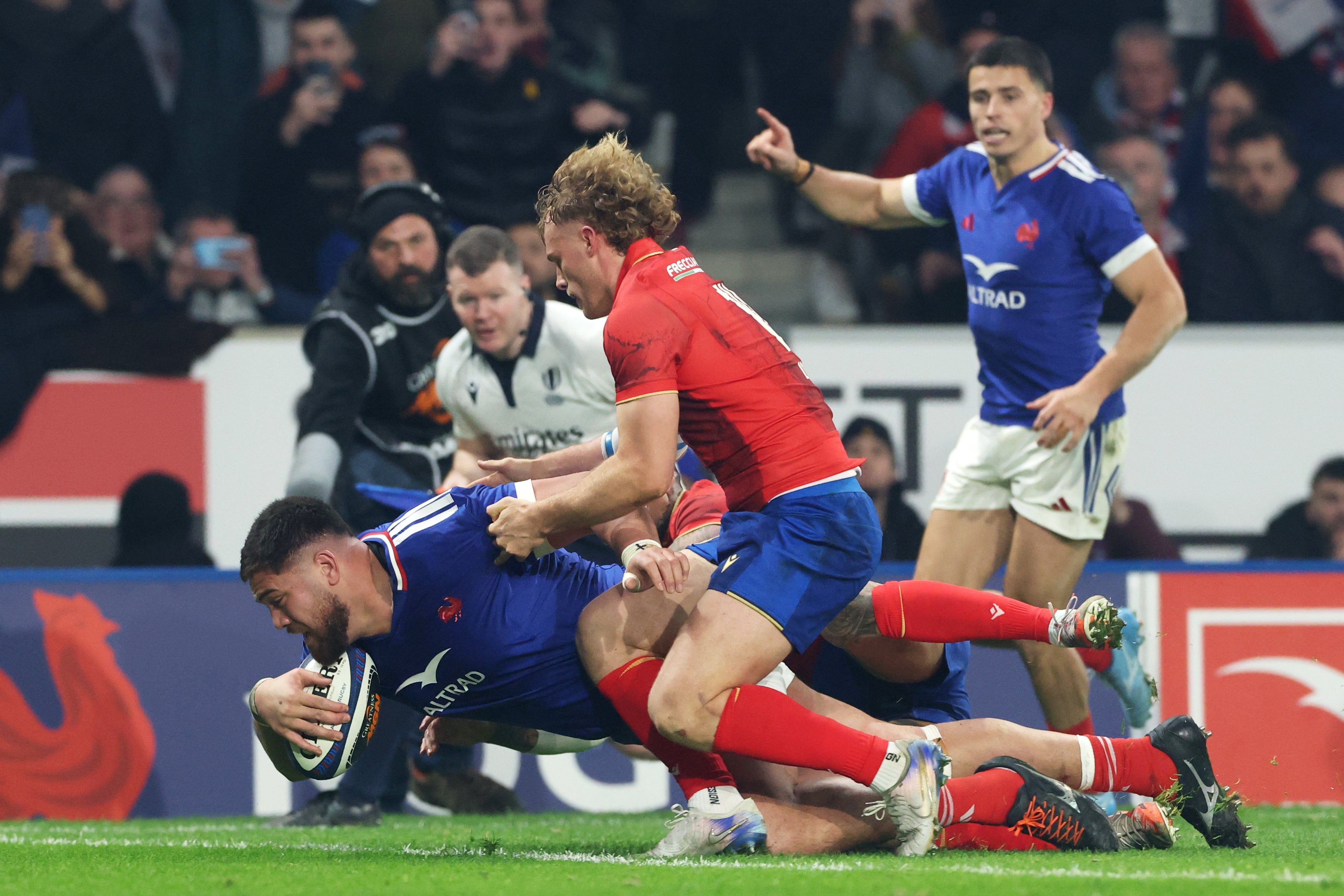 Emmanuel Meafou punched over for a try against Italy