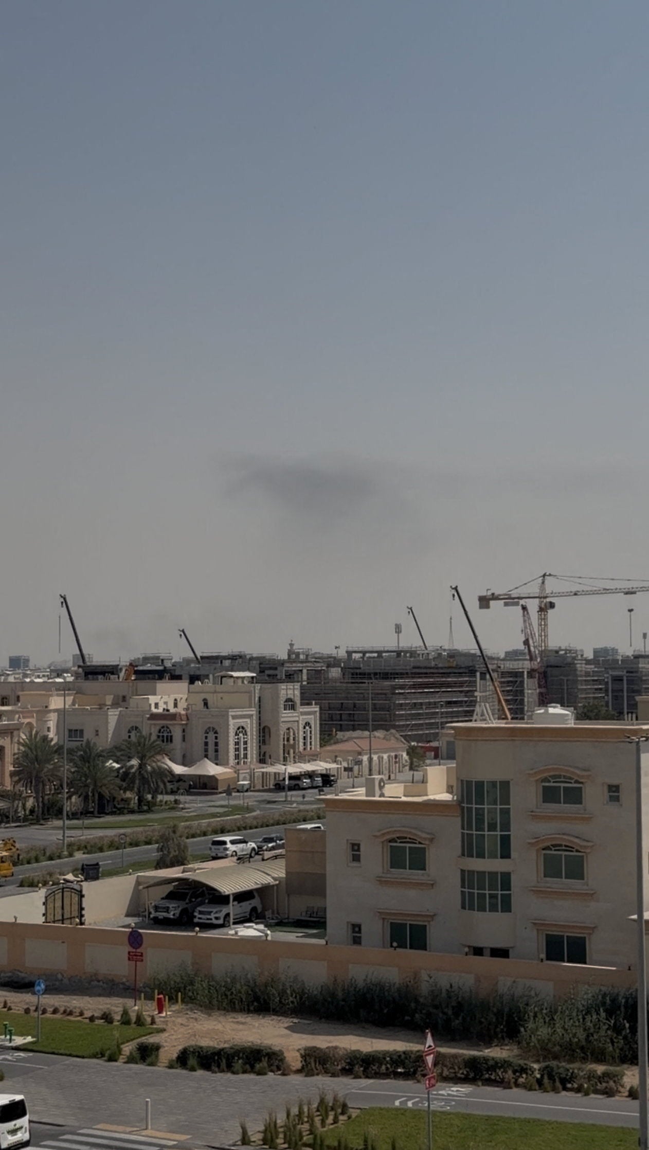 Smoke in the sky after reported blasts were heard, following strikes by the United States and Israel against Iran, in Abu Dhabi, United Arab Emirates, in this still image obtained from a video obtained by Reuters
