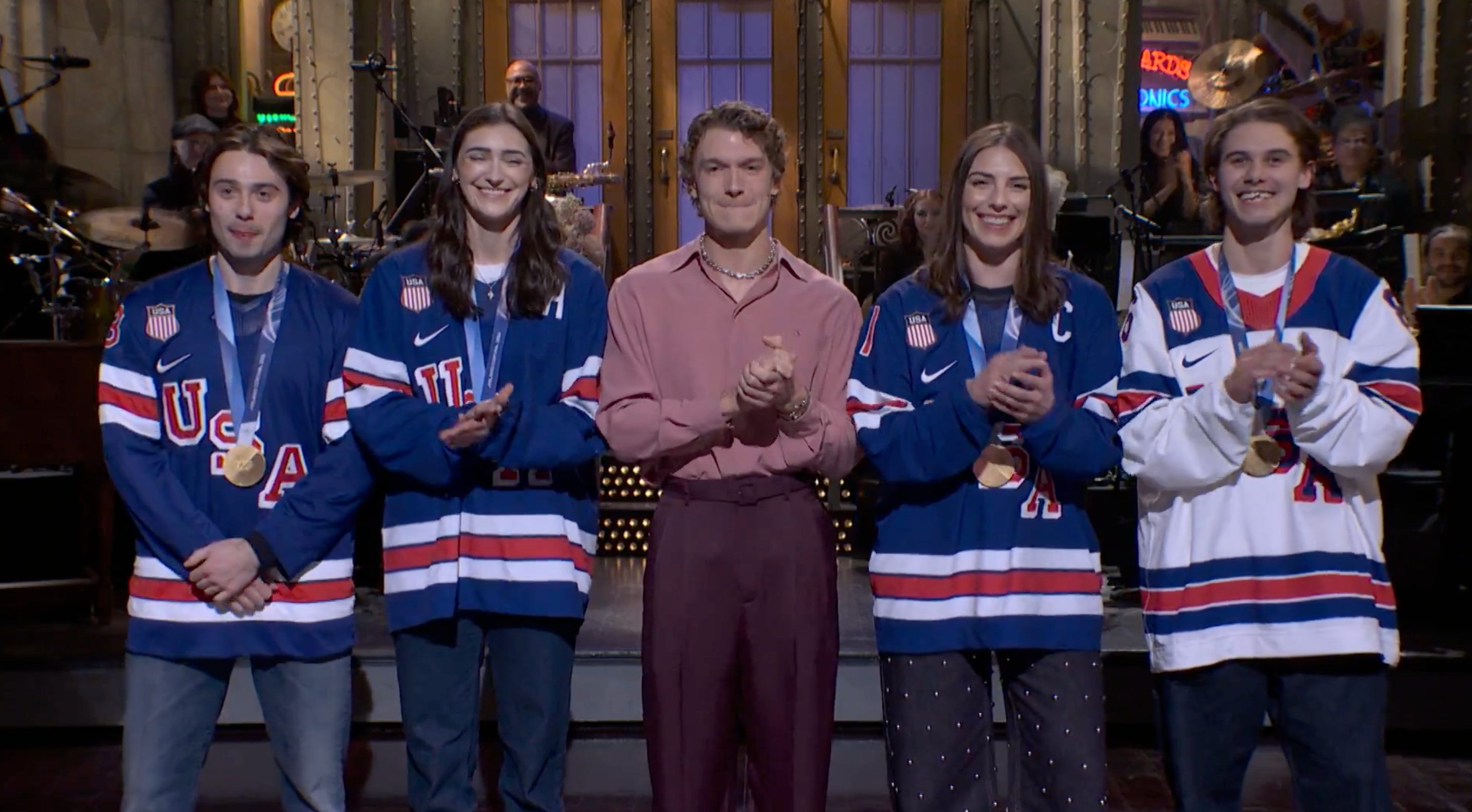US women’s hockey stars poke fun at men’s team over Trump call in joint SNL appearance