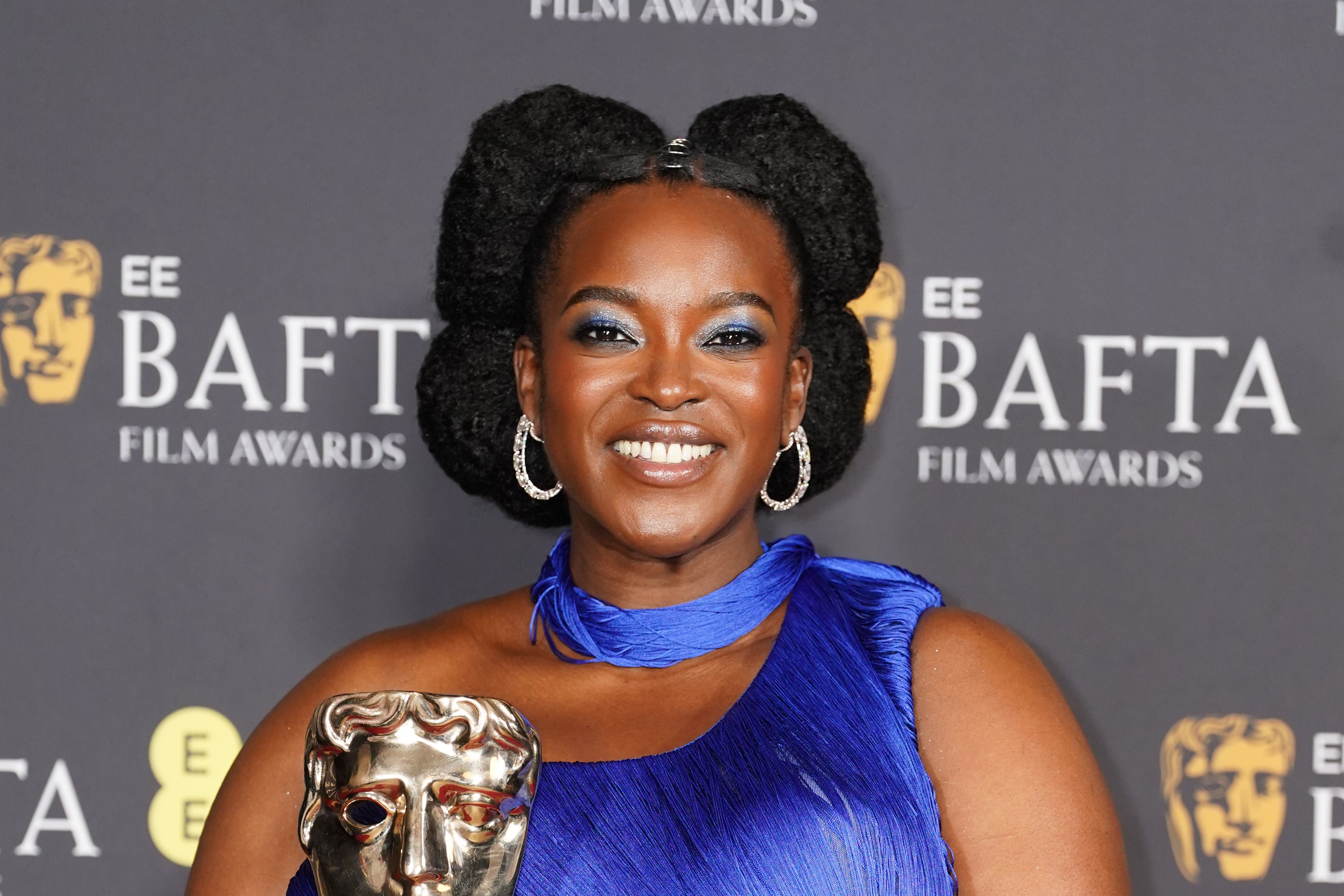 Wunmi Mosaku poses with her award for Best Supporting Actress award during the 79th British Academy Film Awards