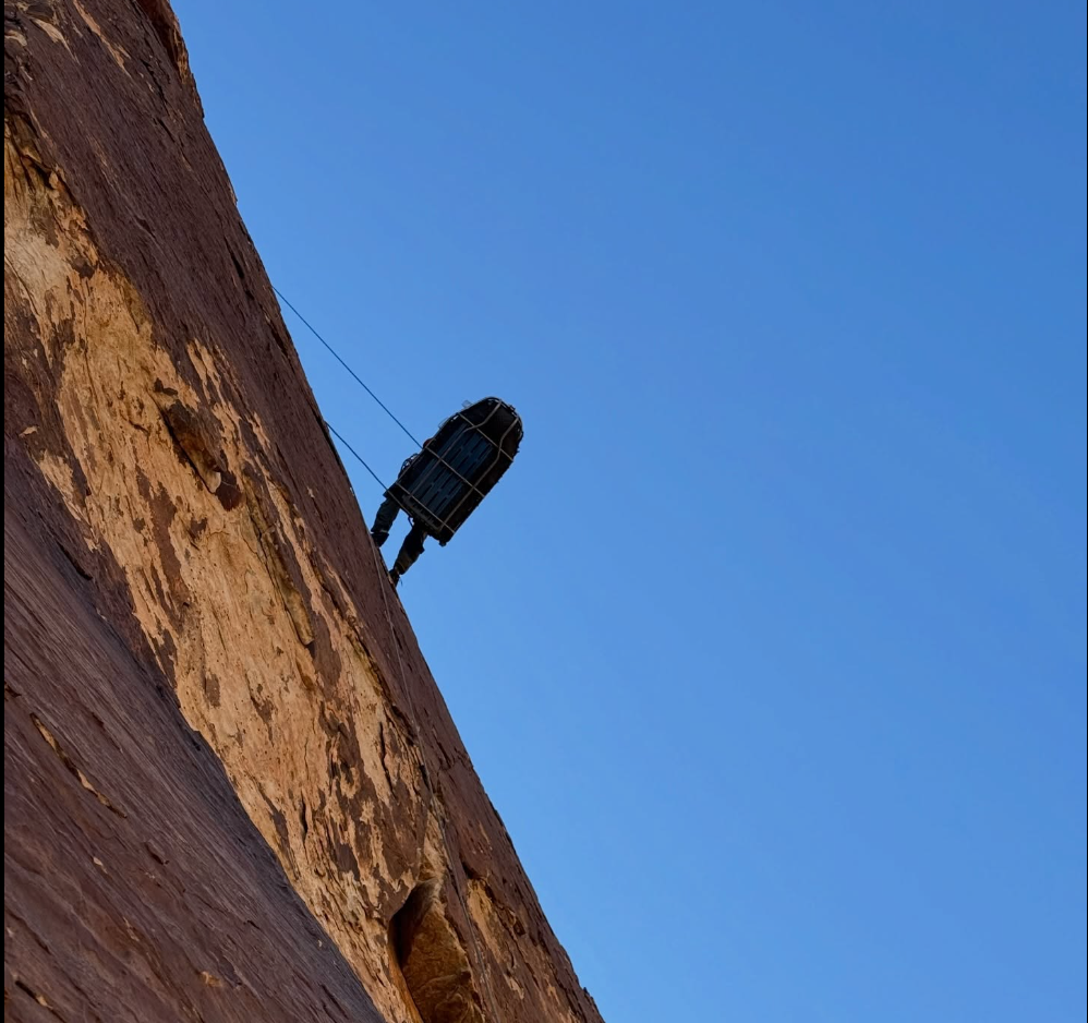 A titanium litter holding an injured climber is lowered from nan 'Dream Safari' climbing way successful Pine Creek Canyon adjacent Las Vegas. A climber fell much than 40 feet and sustained terrible injuries to his caput and back, requiring a rescue from a position connected nan wall astir 600 feet supra ground
