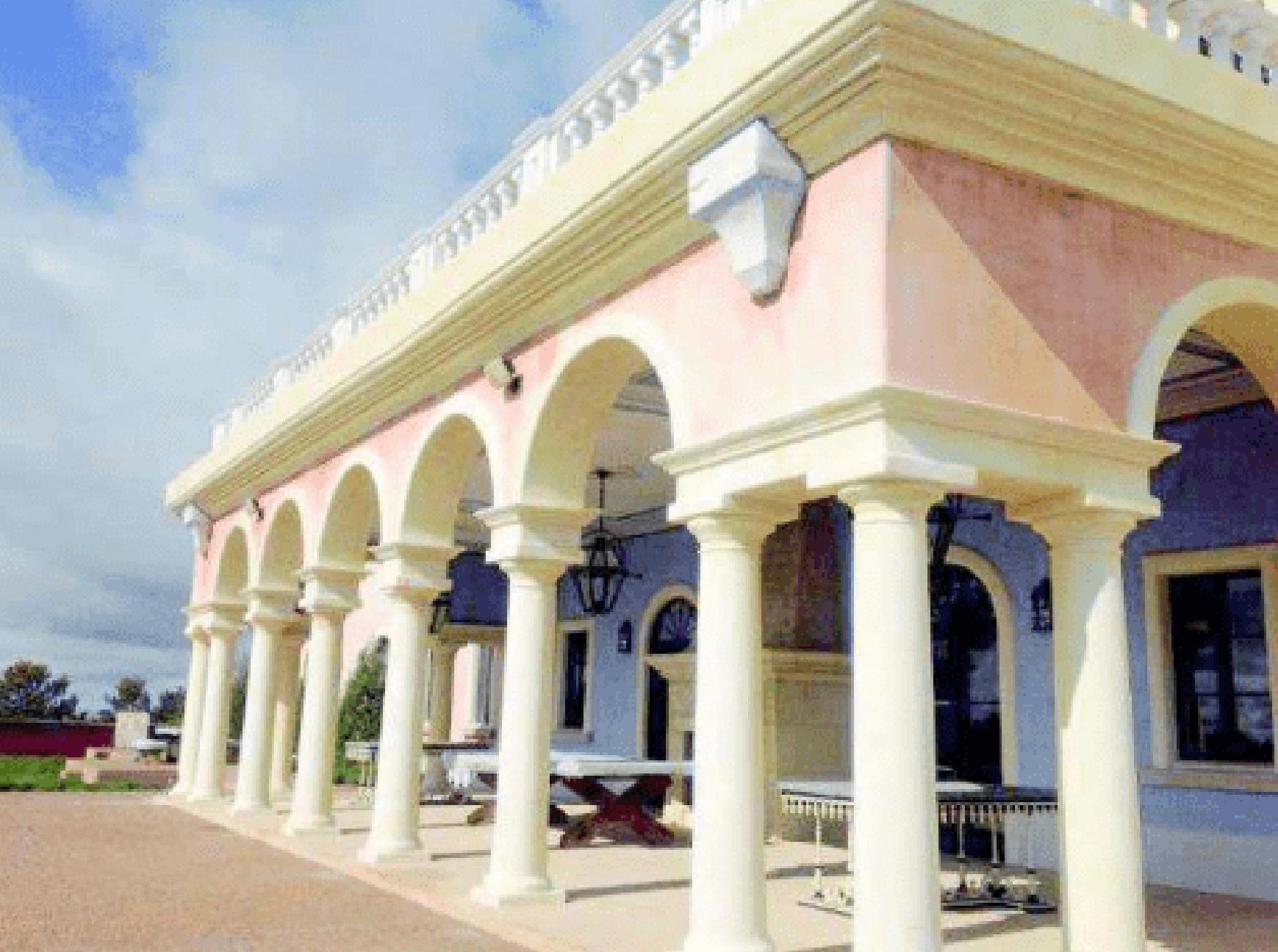 A rear position of nan main building astatine Zorro Ranch, featuring a destruction pinch arches and columns