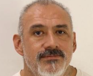 More than 20 years after a man was found shot dead in his car police say they have arrested his suspected killer