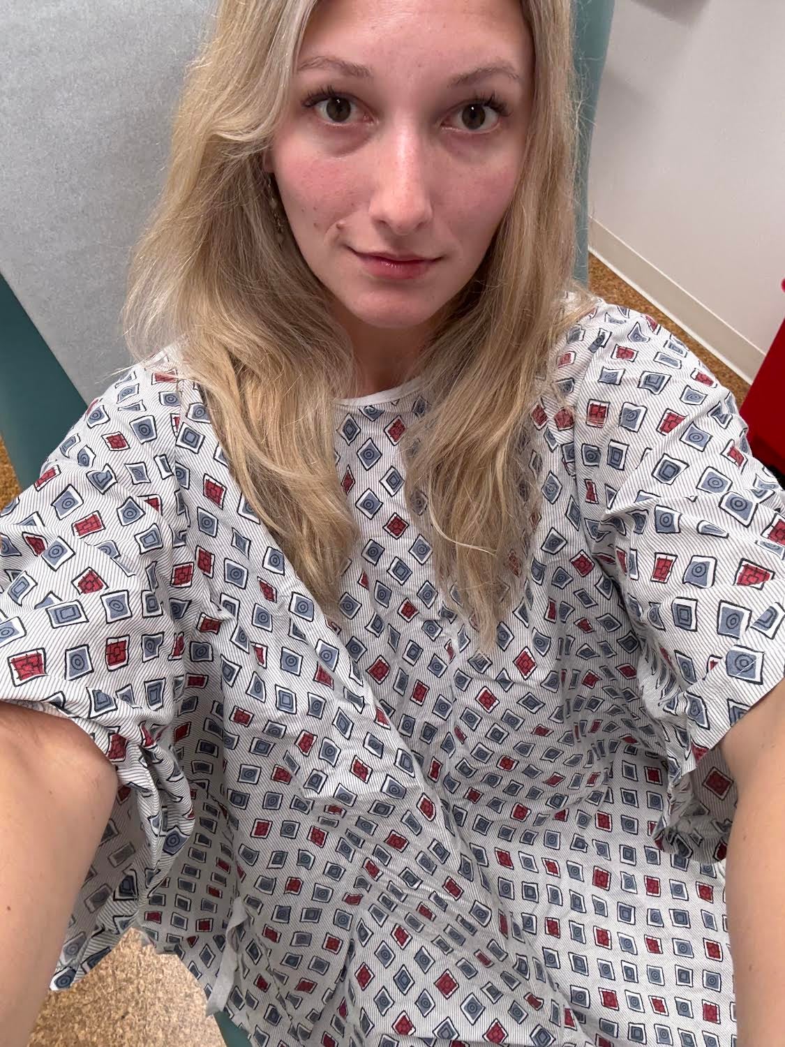The Independent's Julia Musto takes a selfie in her hospital gown before the biopsy