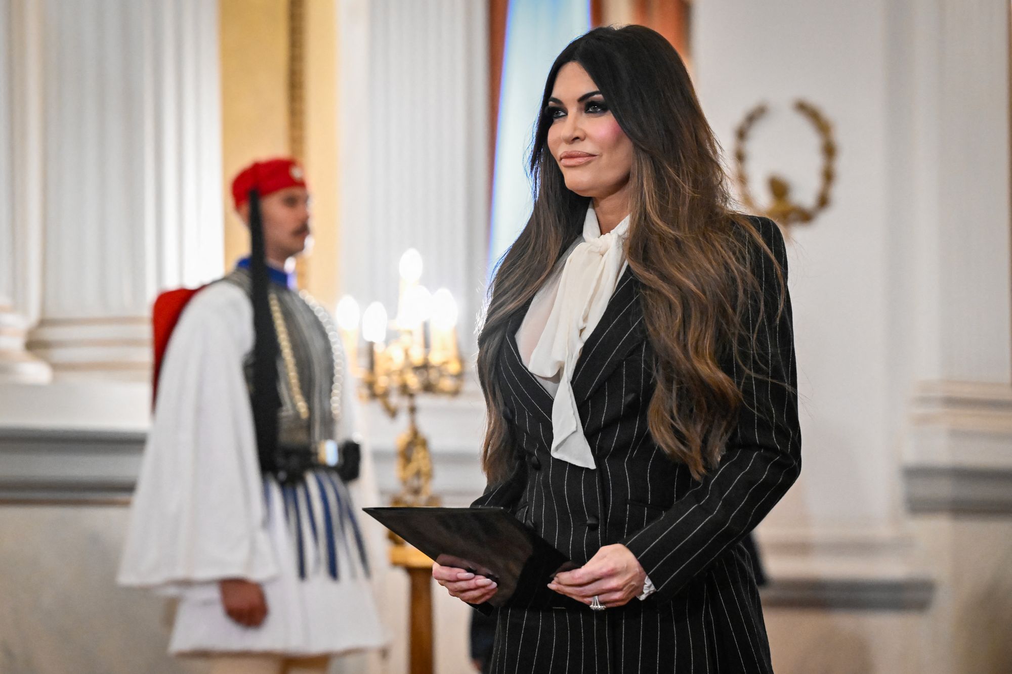 Guilfoyle, serving arsenic US Ambassador to Greece, welcomed nan group of Americans, led by Bruesewitz