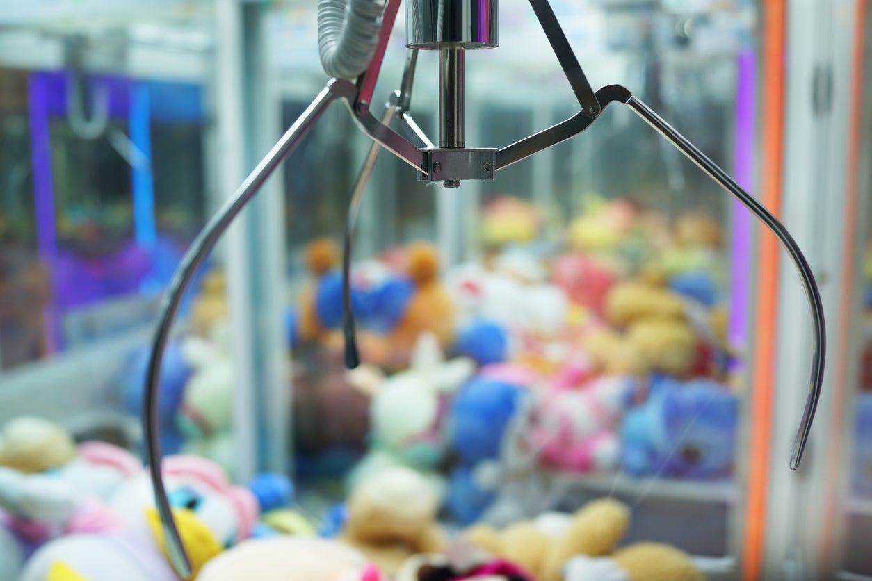 Two children get stuck inside claw machine game after climbing inside to ‘get ball’