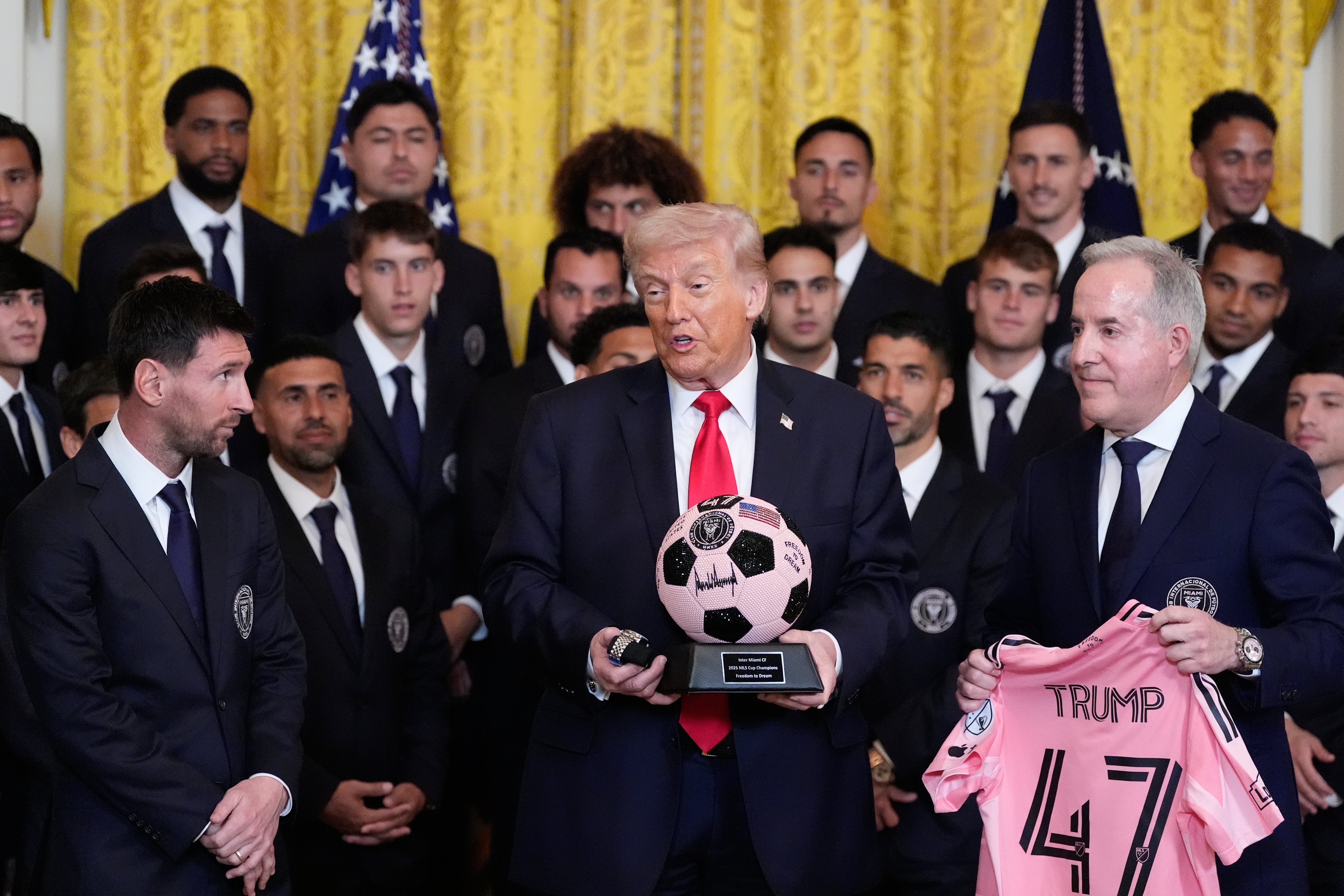 Trump holds a signed shot ball and Tudor Black Bay watch astatine an arena to grant nan 2025 Major League Soccer champions Inter Miami CF successful nan East Room of nan White House