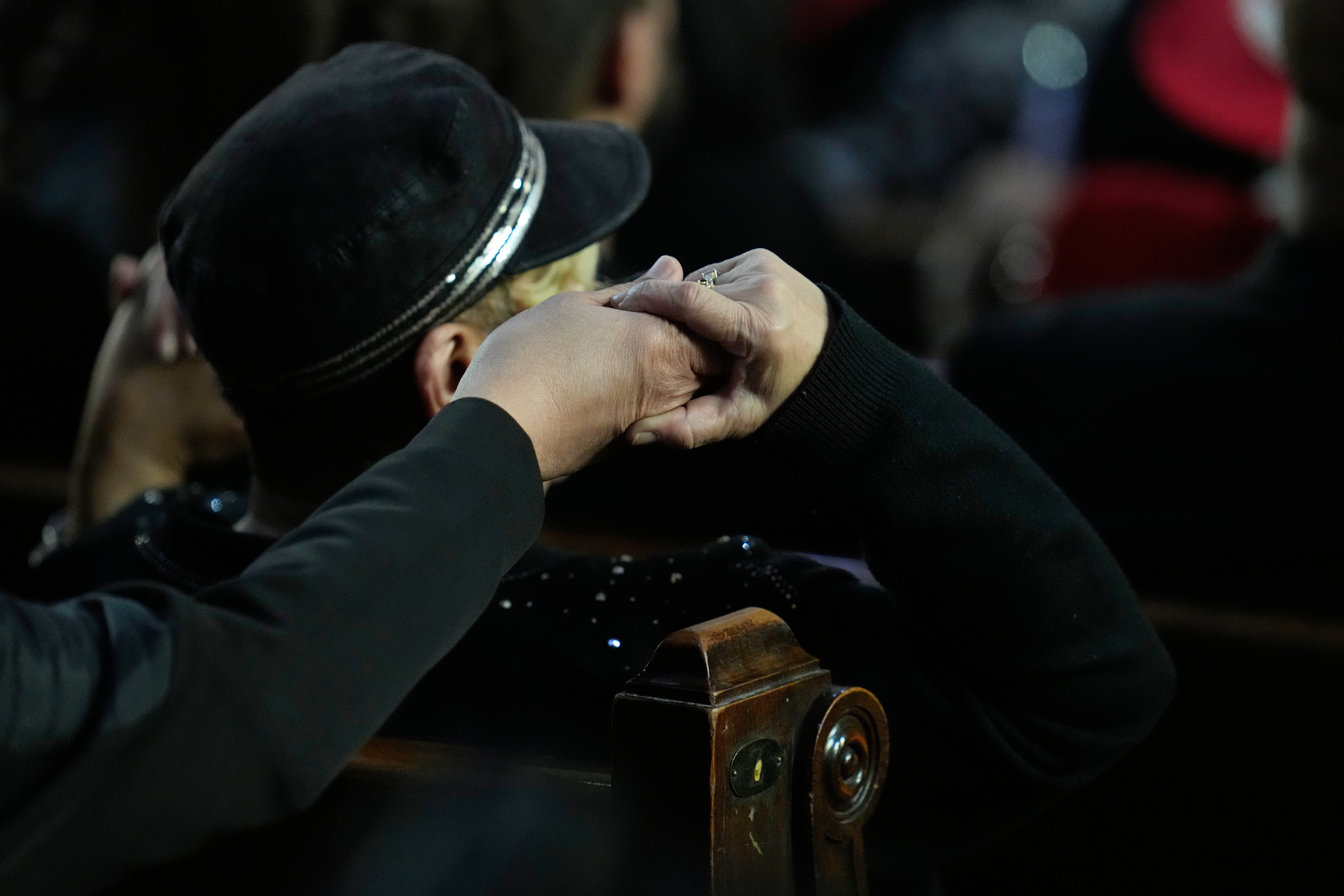 A visitant listens during nan Homegoing Celebration of Life for nan Rev. Jesse Jackson