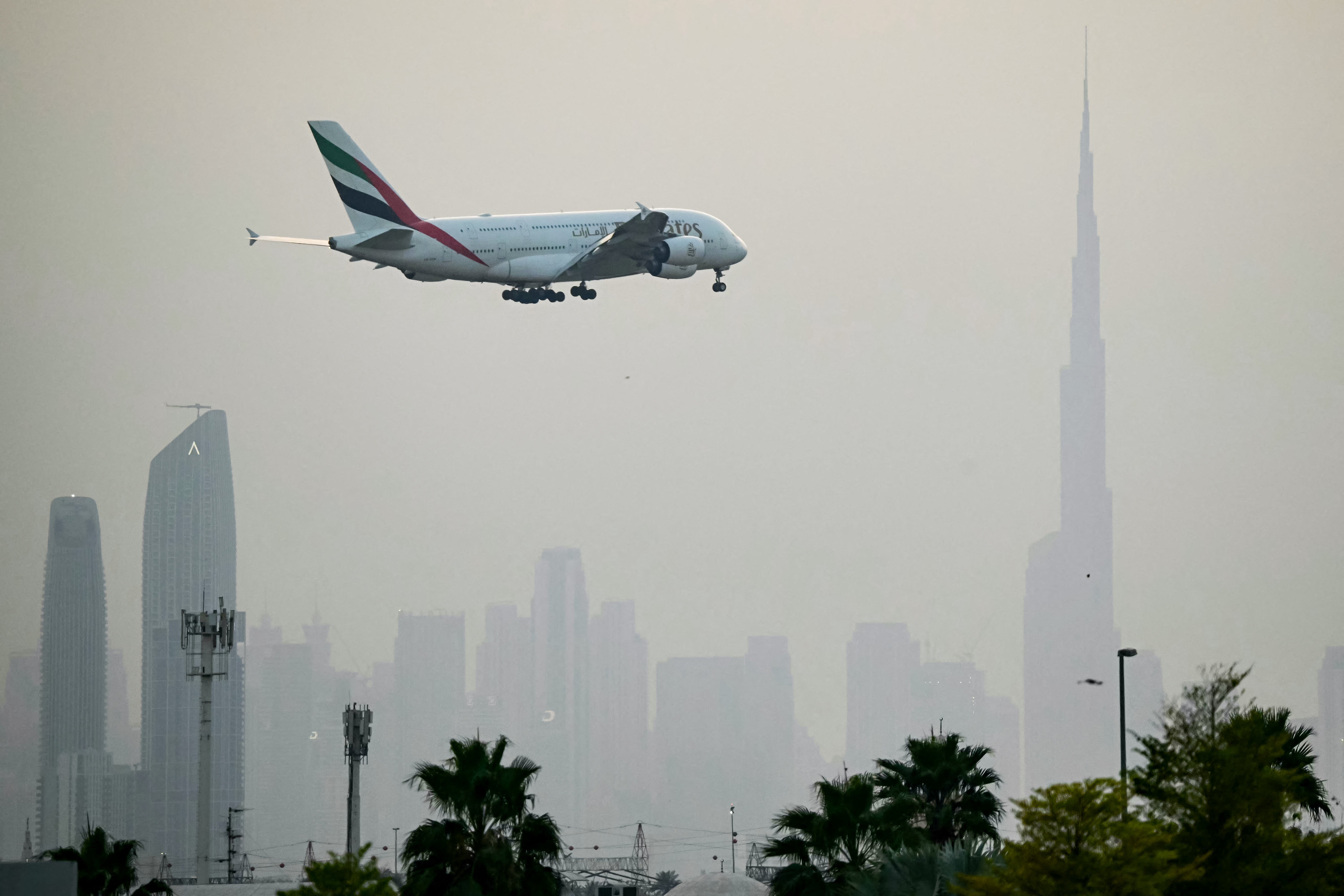 An Emirates Airbus A380 passenger aircraft prepares for landing at Dubai International Airport in Dubai on 8 March 2026. The US and Israel launched strikes against Iran on 26 February, sparking swift retaliation by the Islamic Republic, which responded with missile attacks across the region. (Photo by AFP via Getty Images)