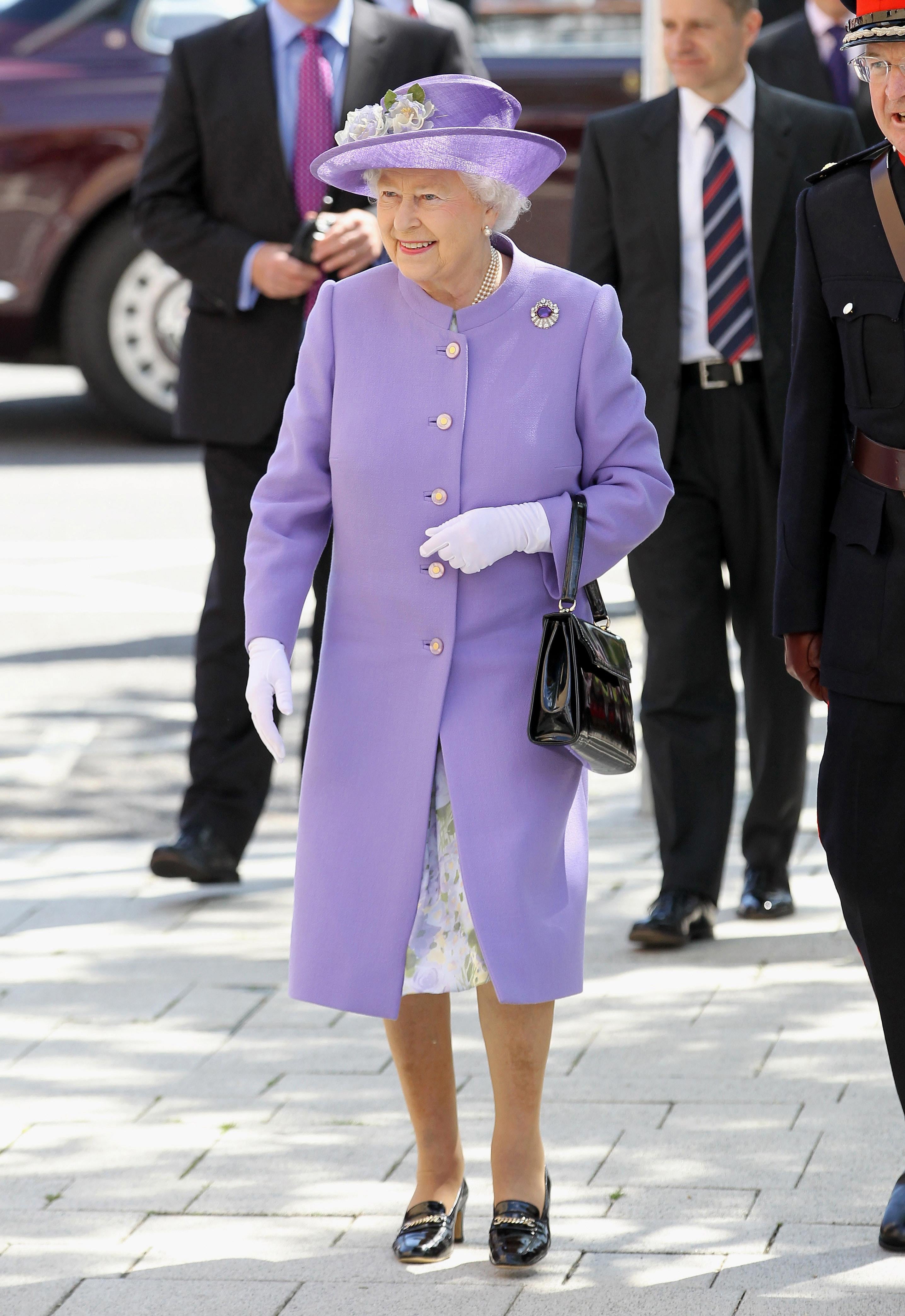 The Queen’s style is often distilled into a block colour dress coat with a matching hat (Chris Jackson/PA)