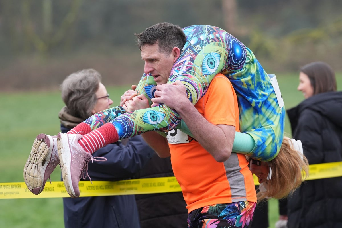 To have and to hold: Couples go extra mile in eccentric UK Wife Carrying Race