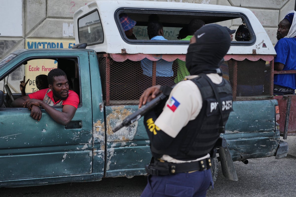 Bodies cover the streets in Haiti as warring gangs torch town and unleash bloodshed