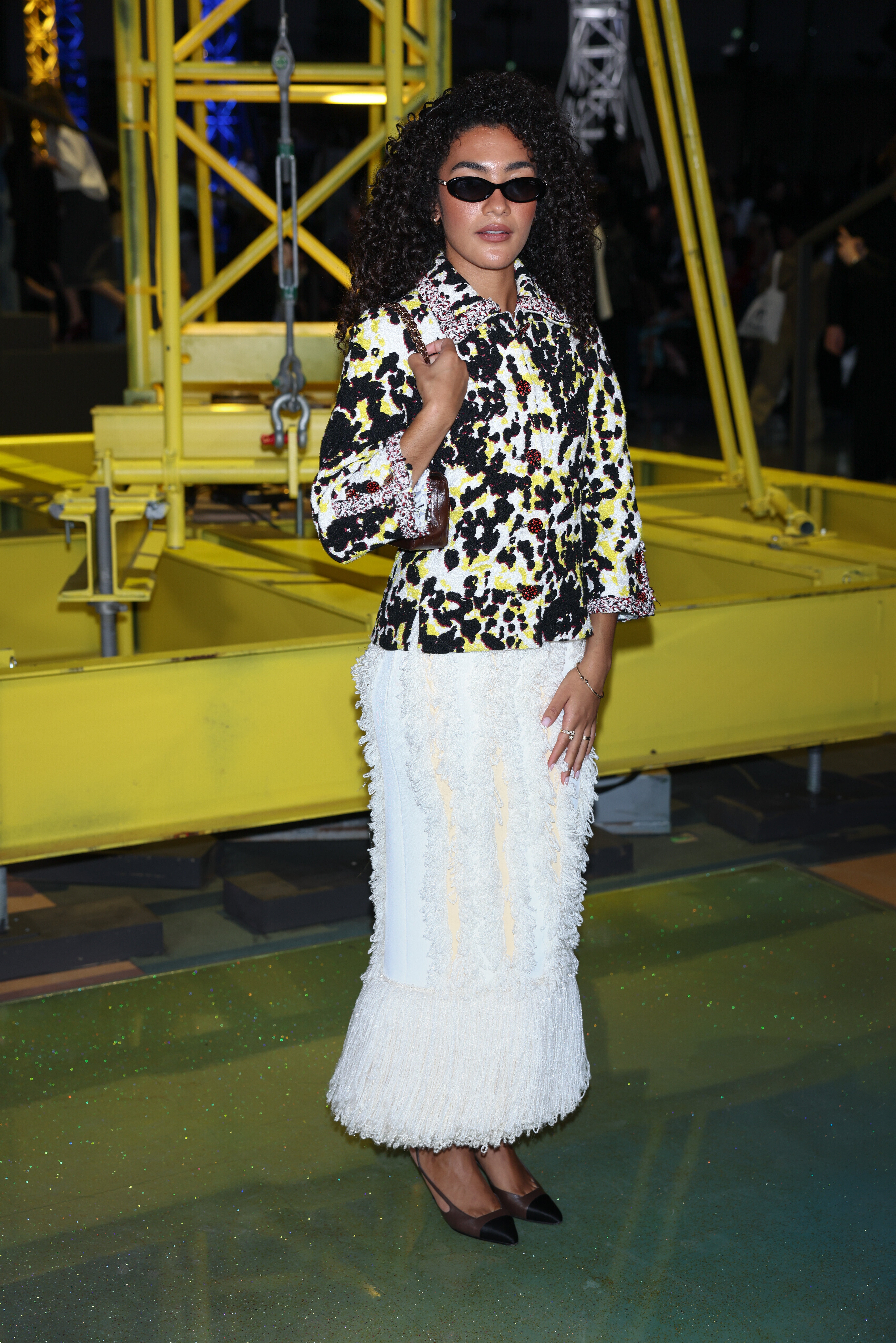 Olivia Dean donned a dalmatian-print jacket and feathered skirt
