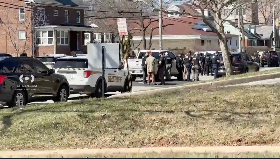 Several constabulary vehicles and officers seen successful a metropolis street