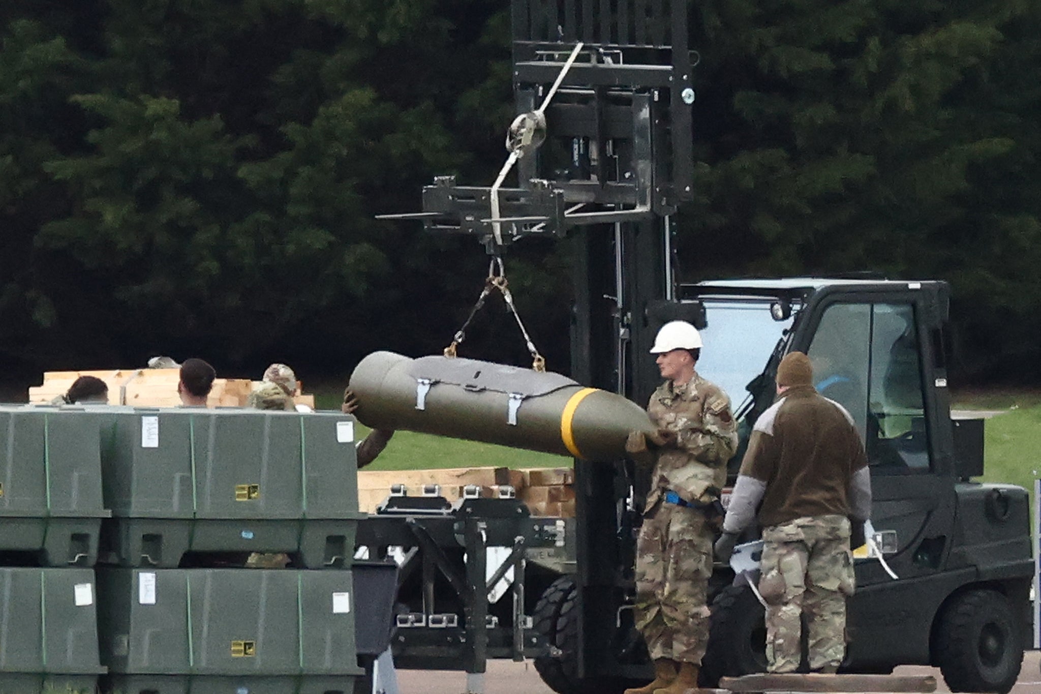 Members of nan US Air Force hole munitions astatine RAF Fairford successful south-west England connected March 10, 2026. U.S. officials reportedly estimate that nan Department of Defense utilized $5.6 cardinal worthy of munitions successful nan first 2 days of nan Iran war
