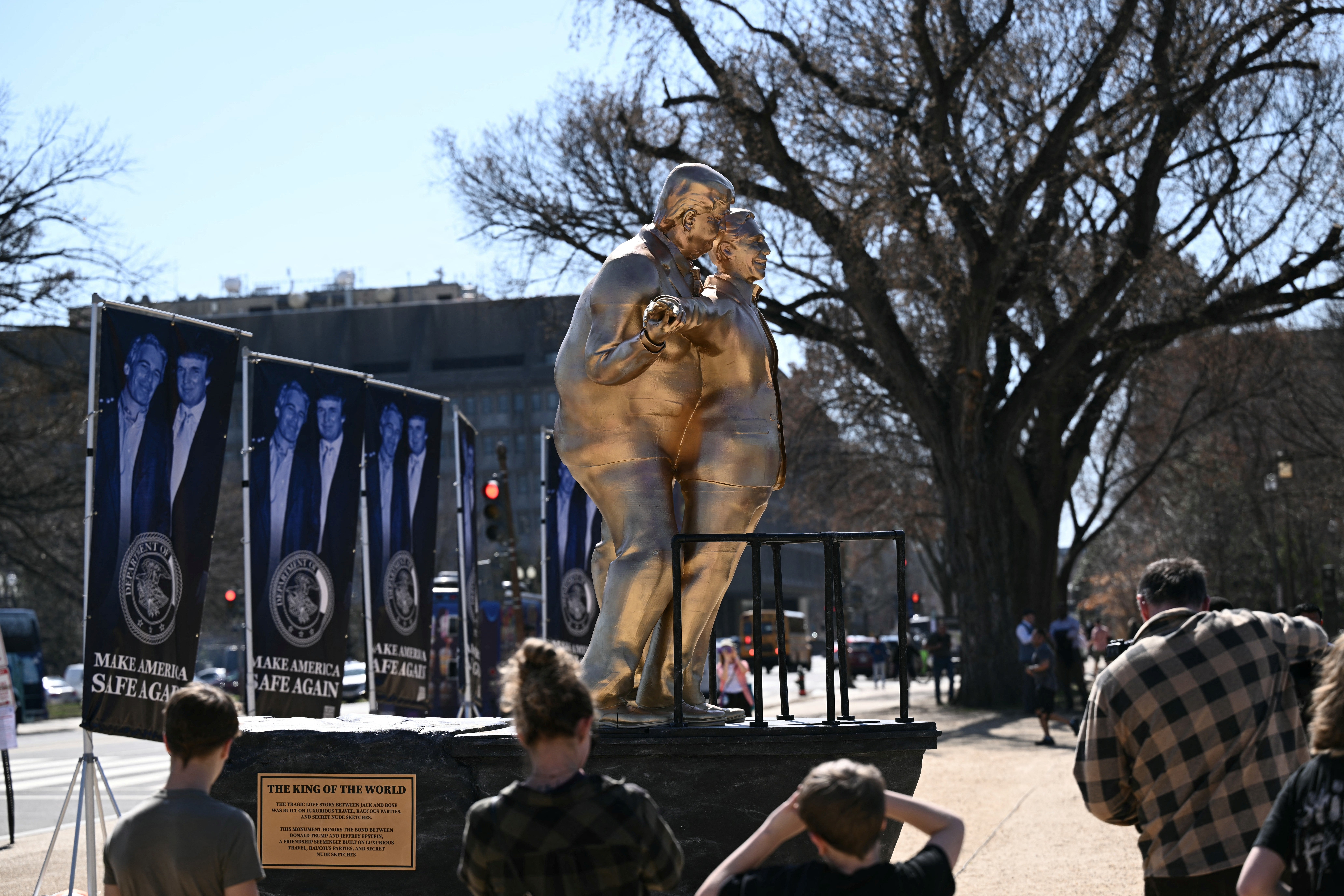 Situated down nan statue were a number of banners displaying a photograph of Trump and Epstein on pinch nan building 'Make America Safe Again'