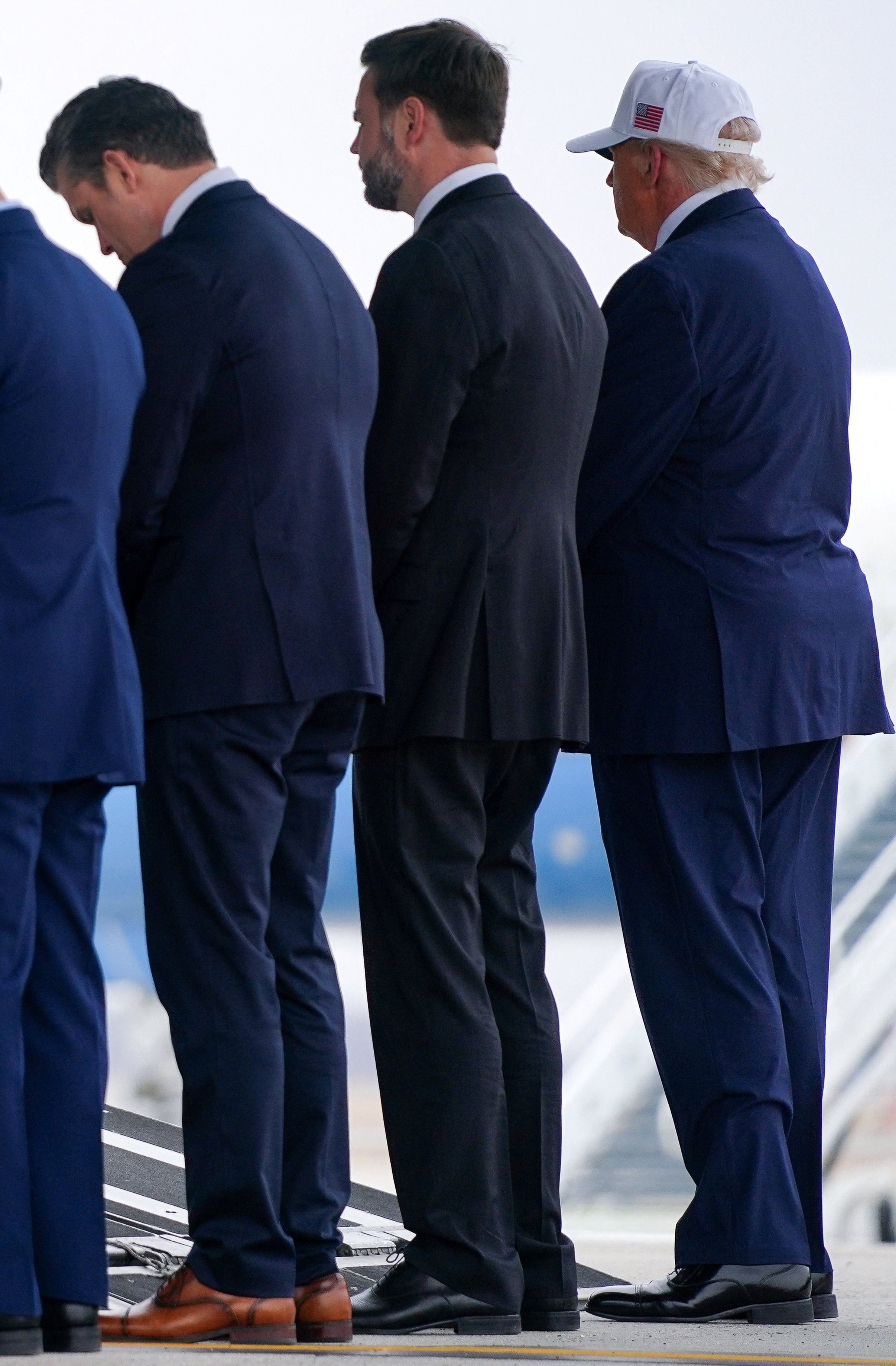 The feet of Trump, Vice President J.D. Vance, and Defense Secretary Pete Hegseth — perchance encased successful Florsheim shoes — during a ceremonial for nan repatriation of U.S. work members killed successful nan warfare pinch Iran successful March 2026