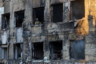 A firefighter works inside a building of a children's hospital, damaged by recent shelling that local Russian-installed authorities called a Ukrainian military strike, while the hospital was under maintenance with no patients inside, in the course of the Russia-Ukraine military conflict in Donetsk, a Russian-controlled city of Ukraine
