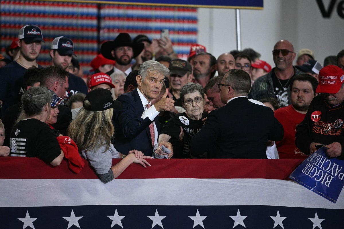 Dr Oz steps in to assist woman who collapsed at Trump rally as president asks staff to play a song while they wait