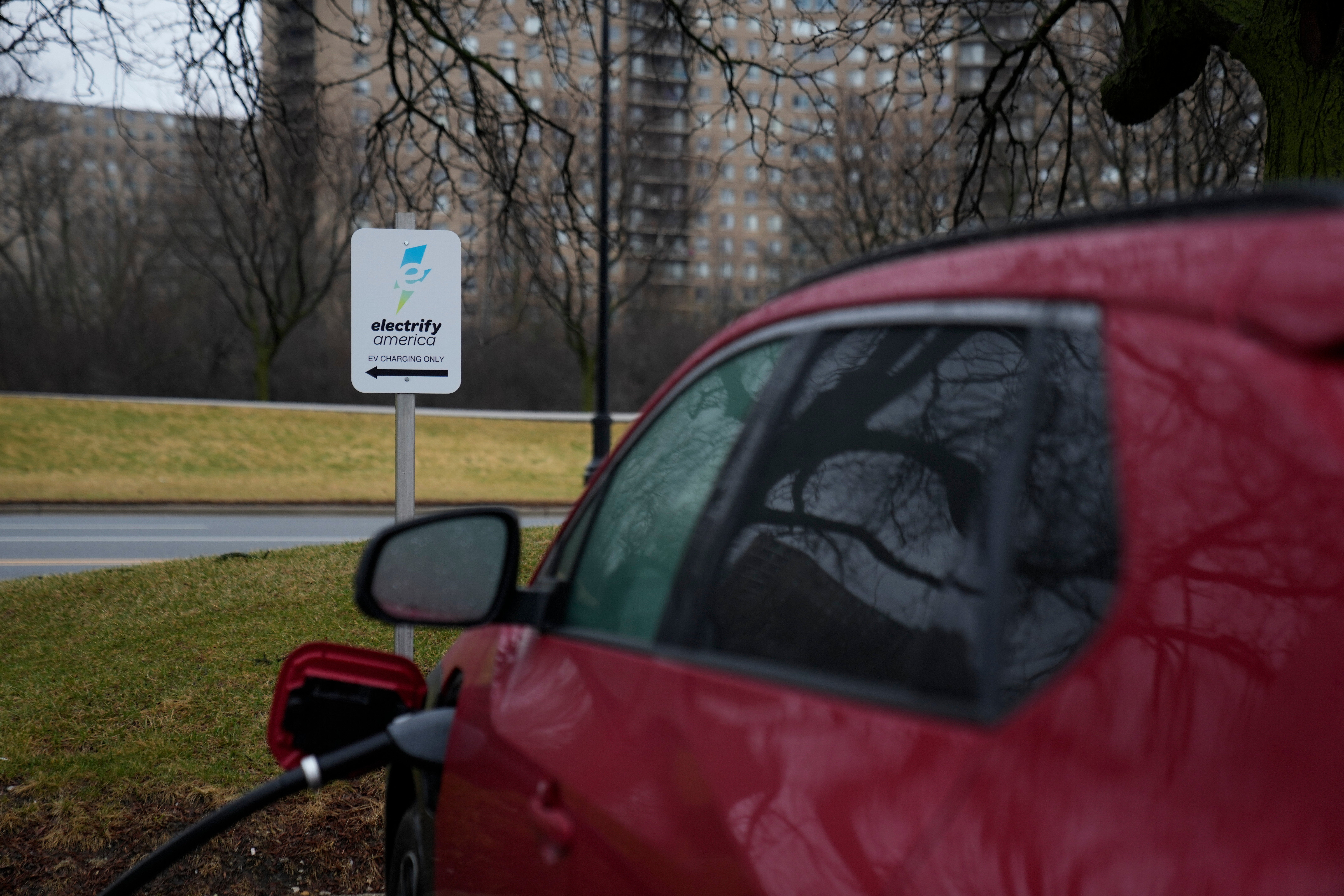 An electric vehicle charges at a station Wednesday, March 11, 2026, in Lincolnwood, Ill. (AP Photo/Erin Hooley)