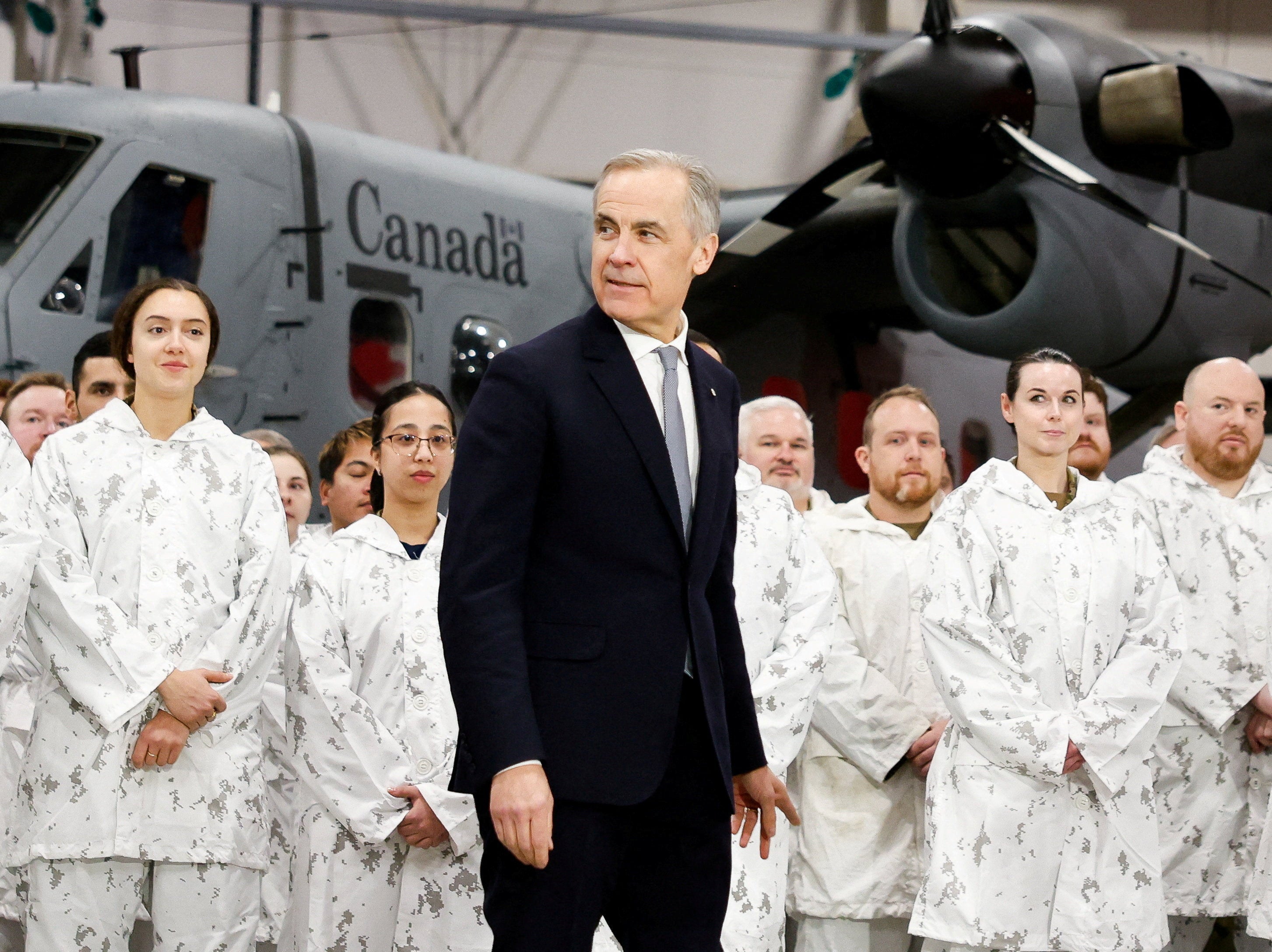 Carney made nan announcement from an airplane hangar successful Yellowknife, flanked by his officials and Canadian troops.
