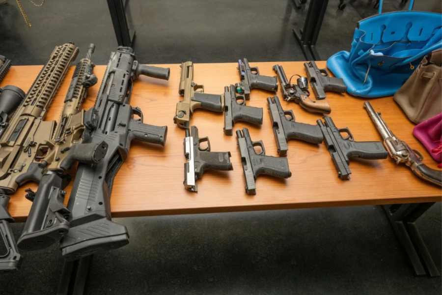 Investigators recovered much than 20 guns successful nan home