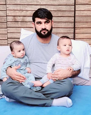Mohammad Nazeer Paktyawal pinch 2 of his children