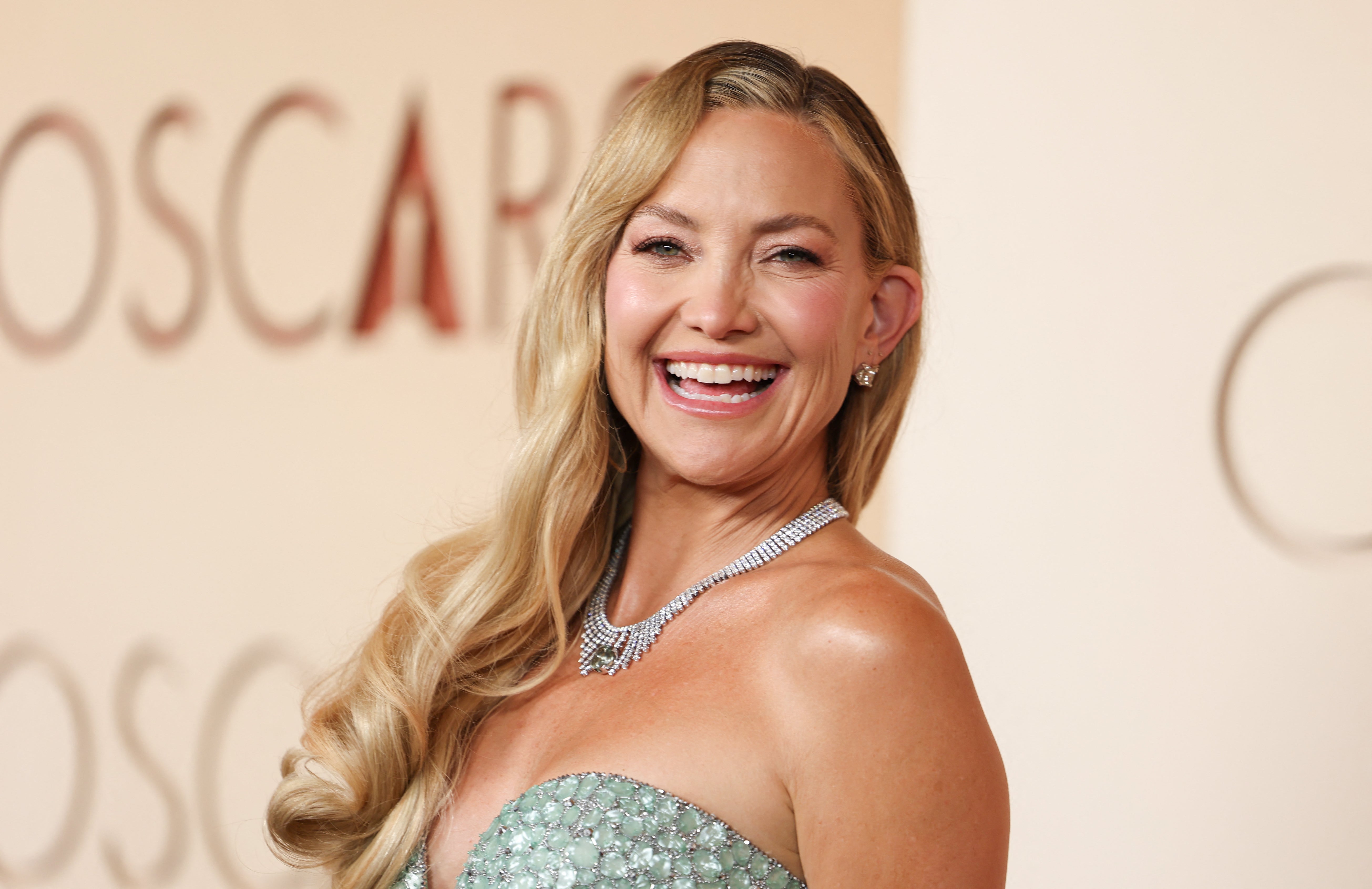 The Oscar nominee paired the diamond look with a matching green statement necklace and pink lipstick