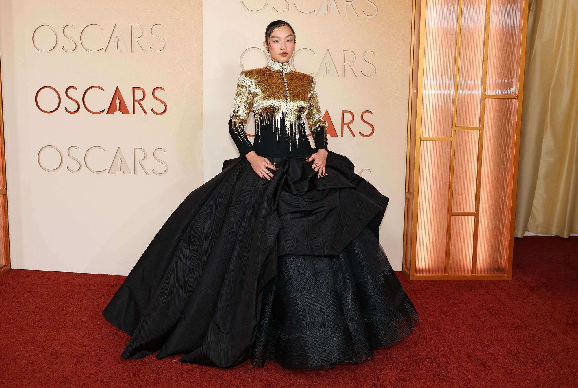 Her ensemble featured a gold choker neckline and a black puffy skirt, while she kept her makeup soft and simple with nude lipstick