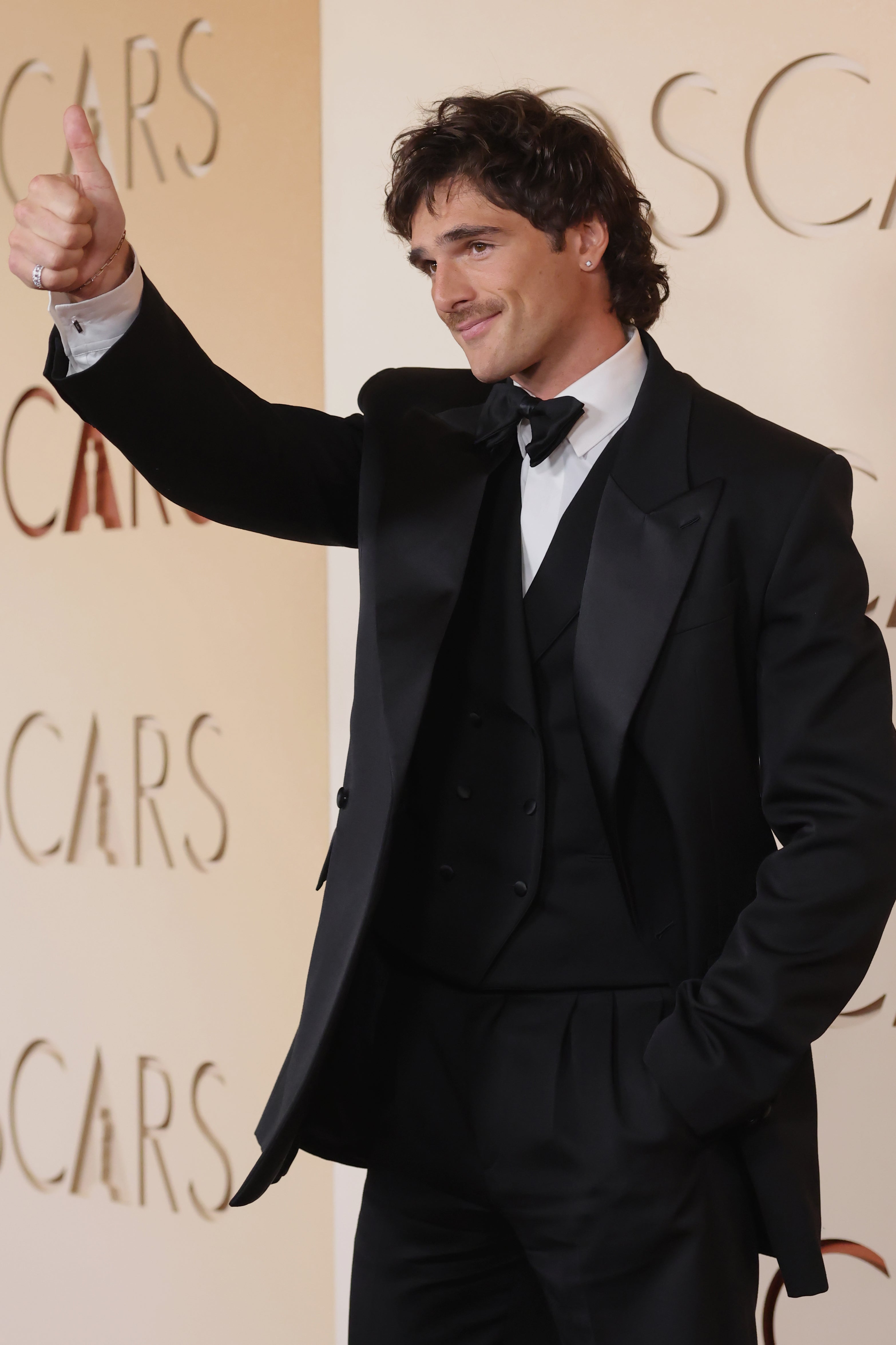 The ‘Frankenstein’ star wore a chic black waistcoat underneath his jacket