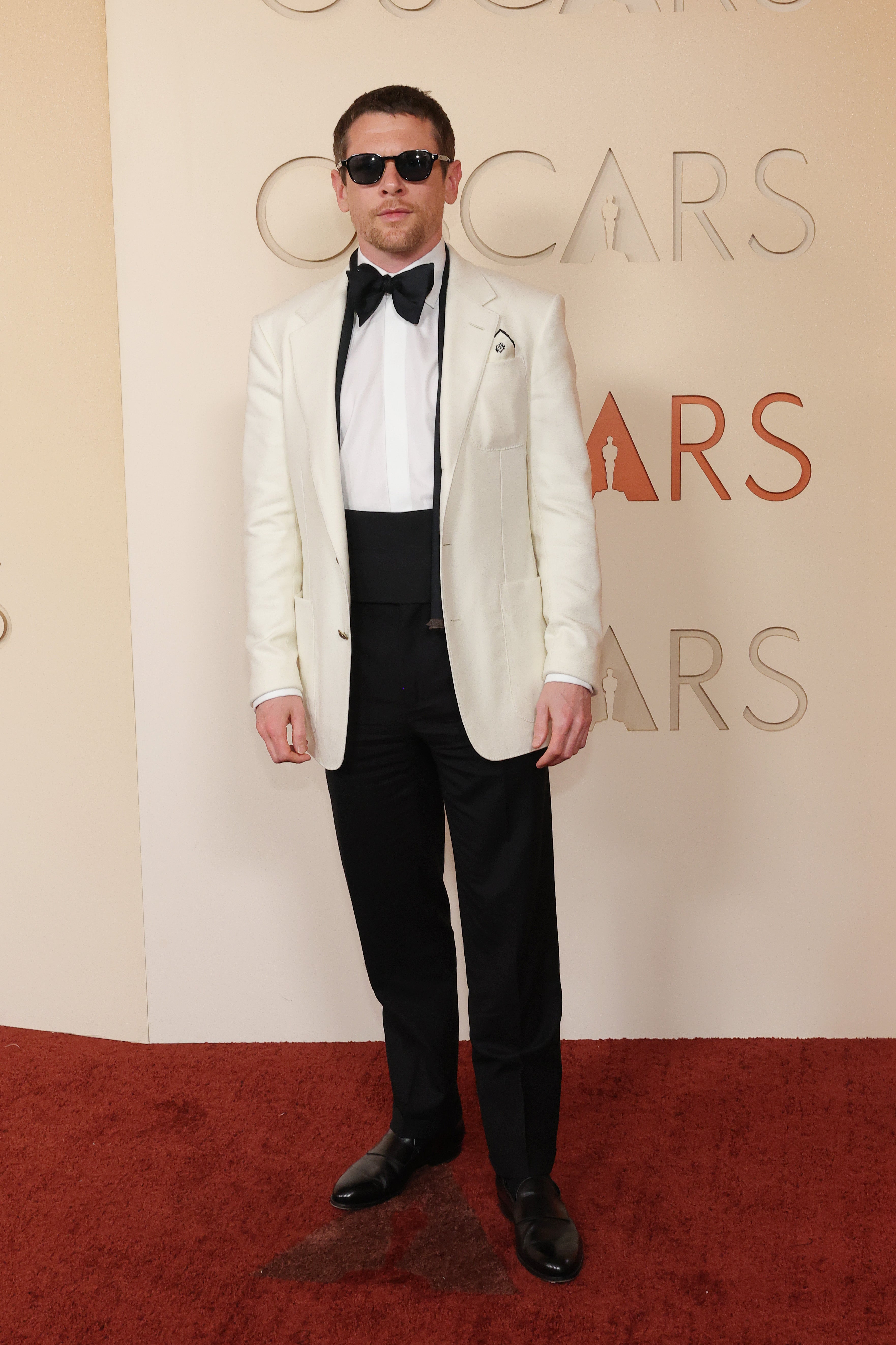 O’Connell hid his fangs at first as he wore a classic white dinner jacket and bowtie