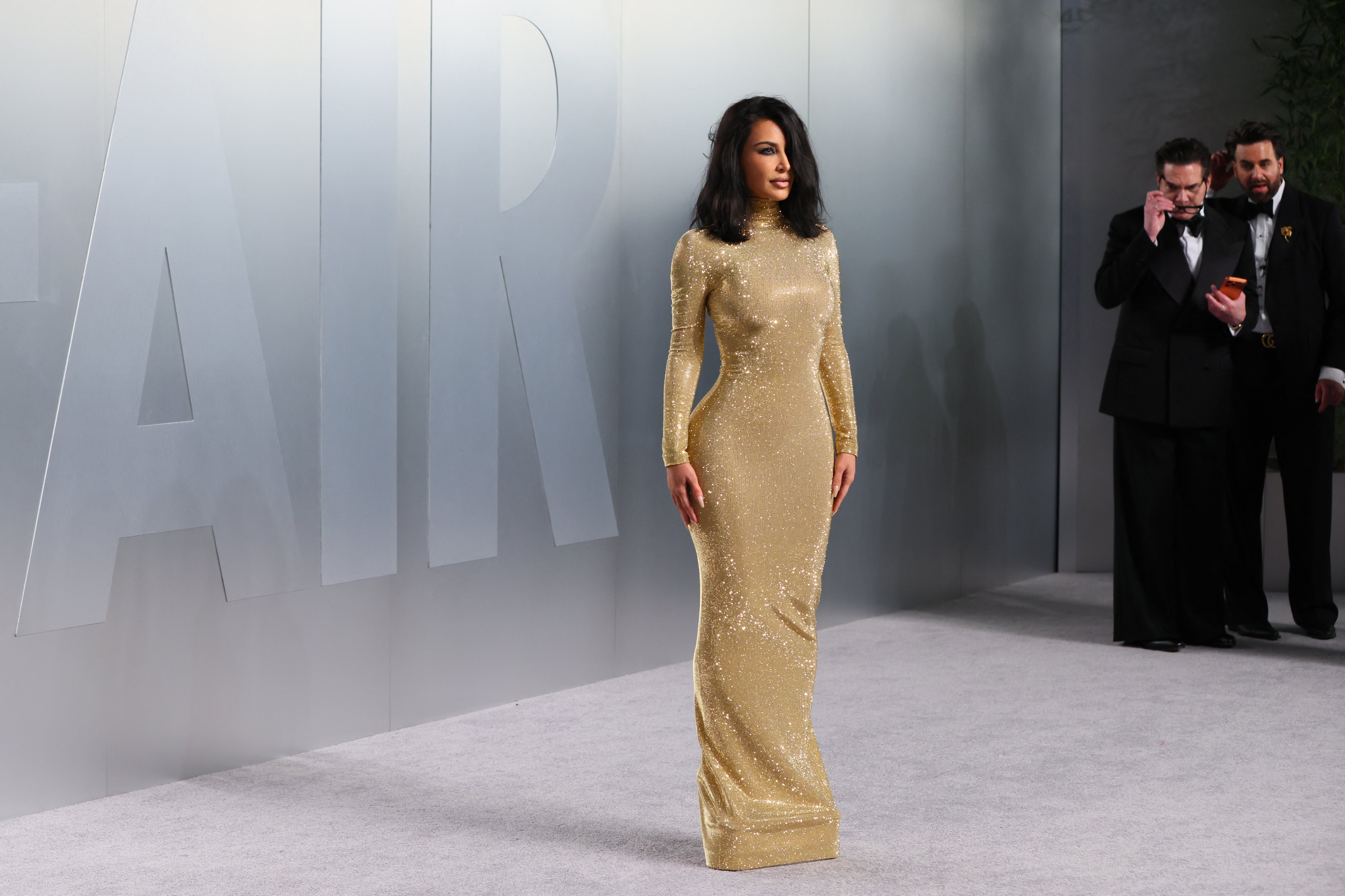 Kim Kardashian was on the Vanity Fair red carpet, clad in a seemingly difficult to walk in gold gown