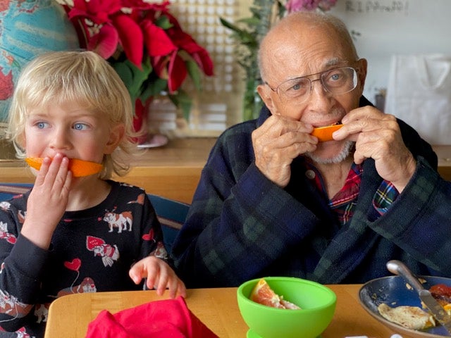 Ted Carter, right, and his grandson Westley eat breakfast together. Vanessa Louise Carter got hospice care for her father but recognizes that not everyone can afford that kind of care for their aging parents