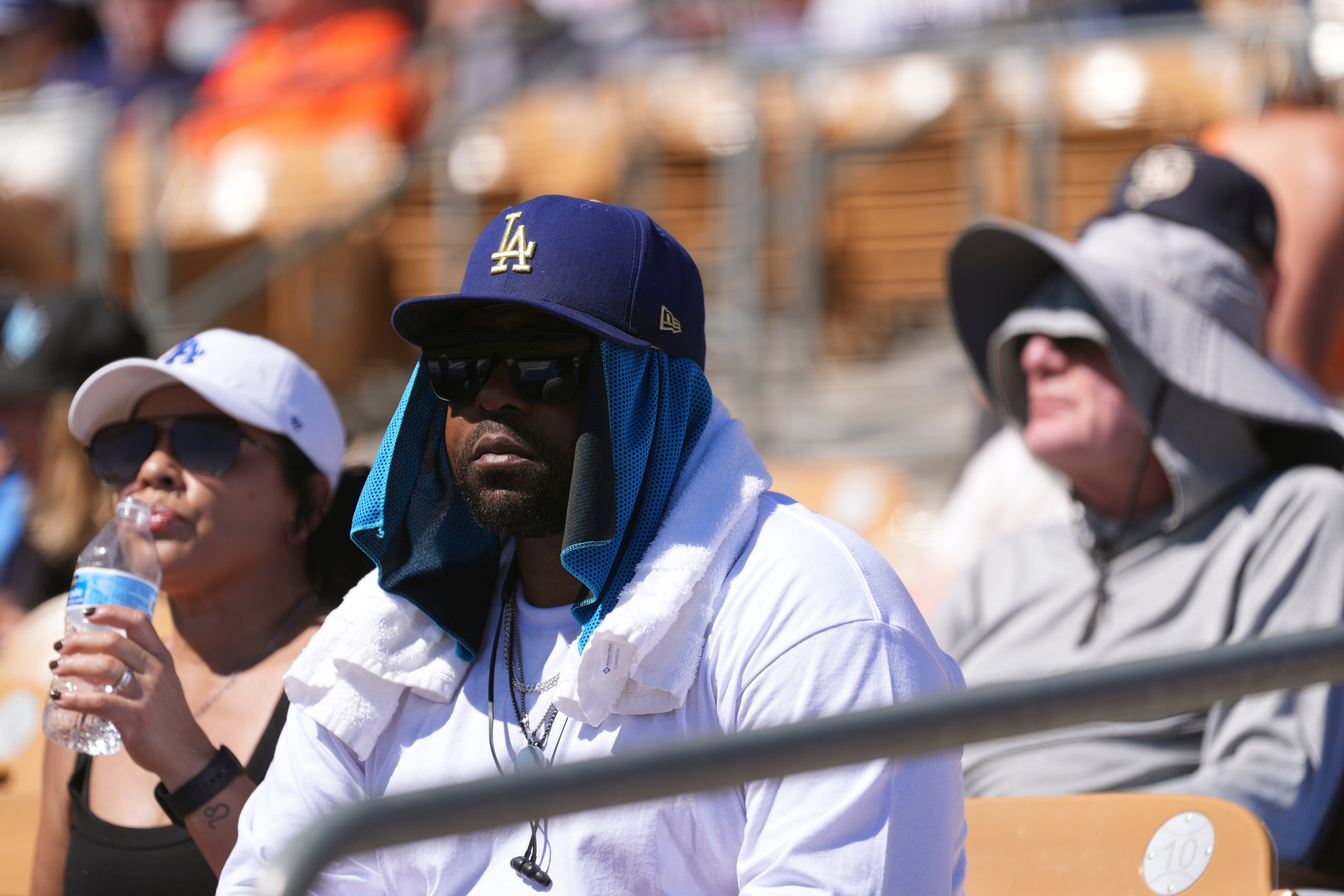 Baseball fans watch nan Los Angeles Dodgers play nan San Francisco Giants during nan 5th inning of a outpouring training shot crippled pinch nan power forcing nan crippled to extremity early.