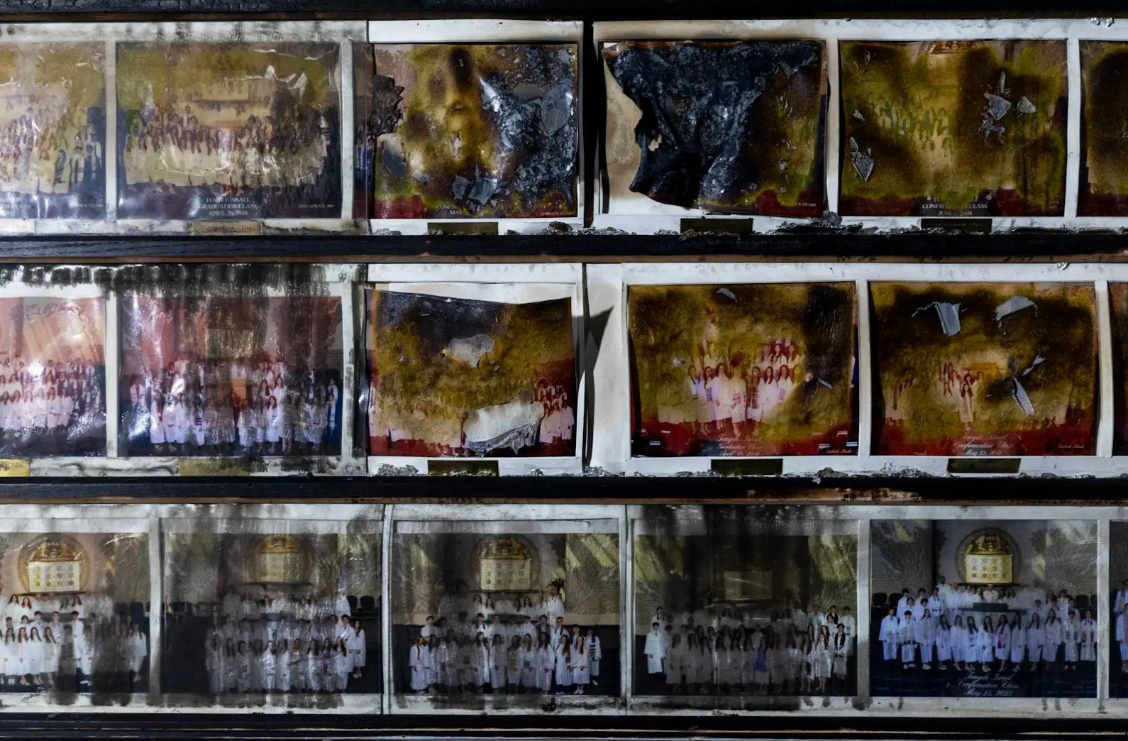 Images released by Temple Israel Thursday show group photos wherever faces person each been melted away