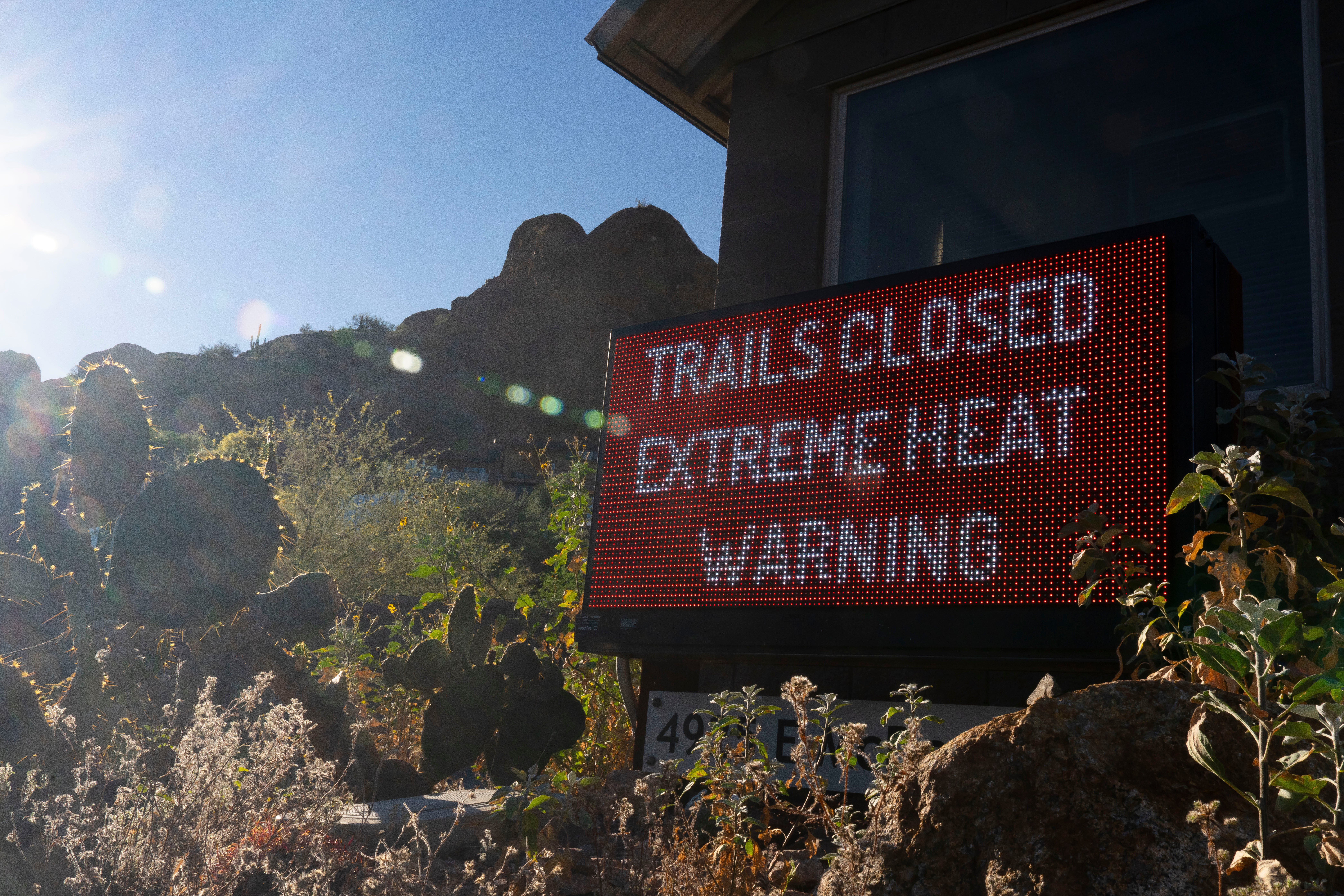 A motion warns hikers of way closures owed to utmost power astatine Camelback Mountain.