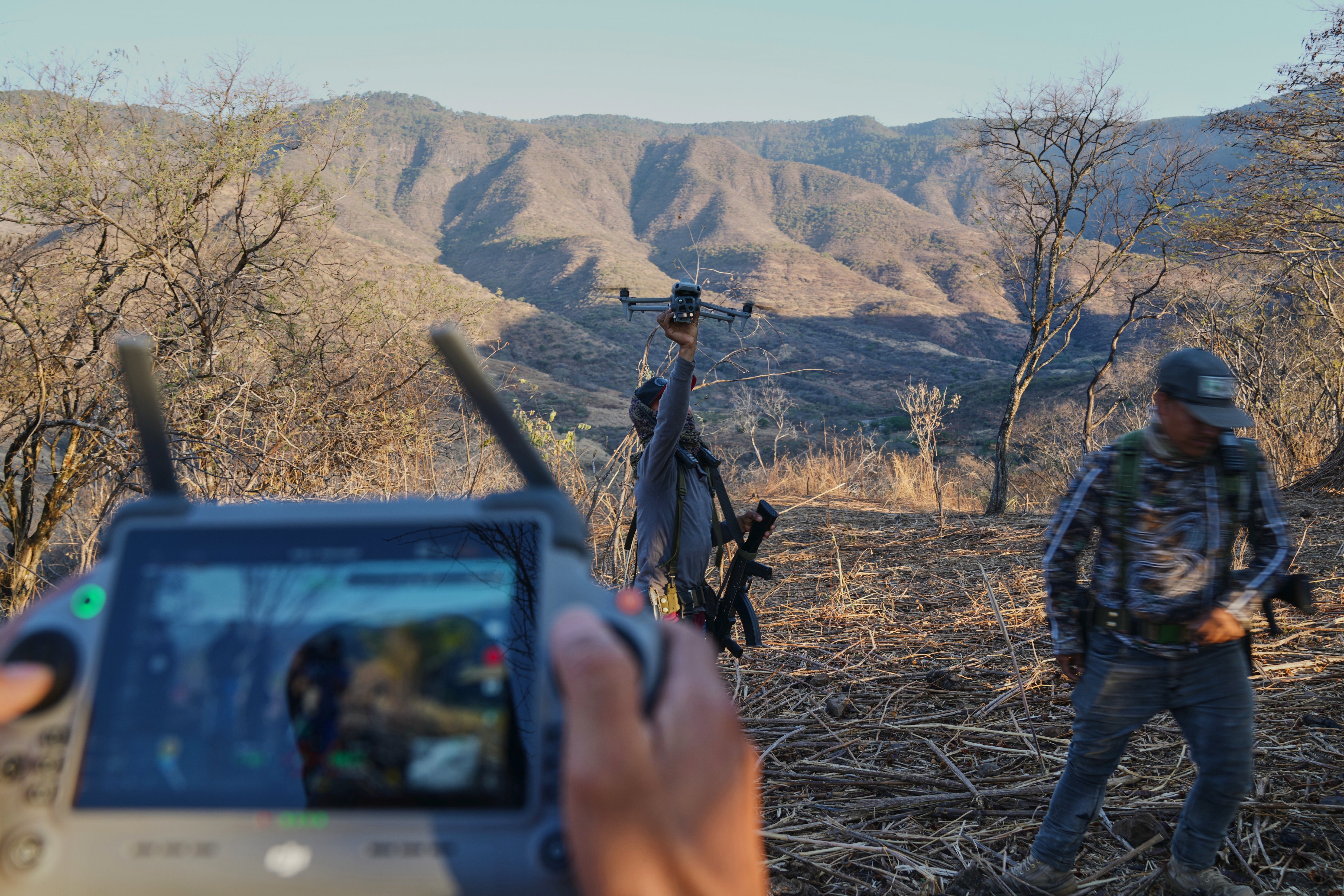 Members of a section self-defense group formed by residents successful consequence to cartel unit alert a drone successful Guajes de Ayala, Mexico, Tuesday, March 10, 2026. (AP Photo/Marco Ugarte)
