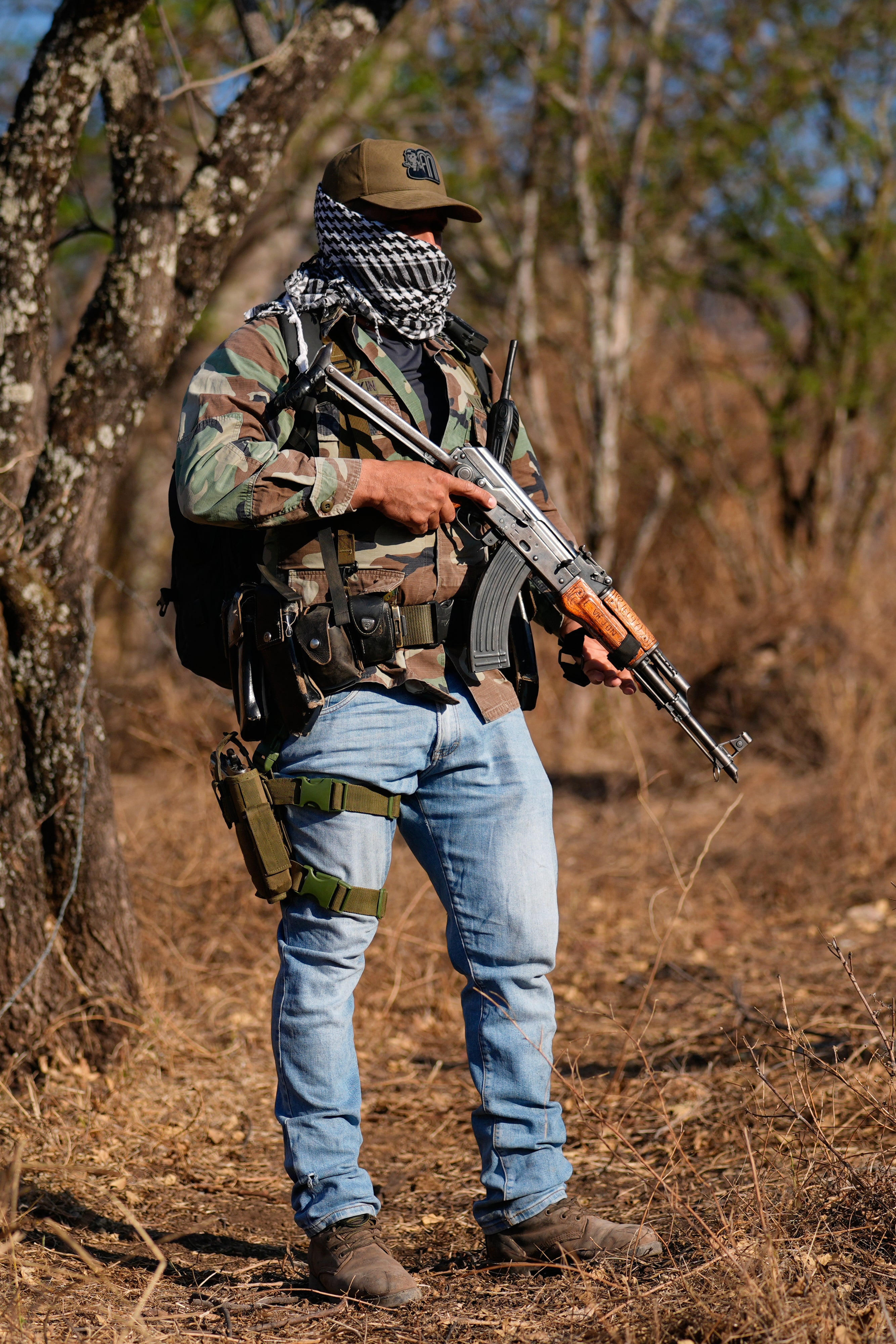 A personnel of a section self-defense group formed by residents successful consequence to cartel unit stands defender successful Guajes de Ayala, Mexico, Tuesday, March 10, 2026. (AP Photo/Marco Ugarte)