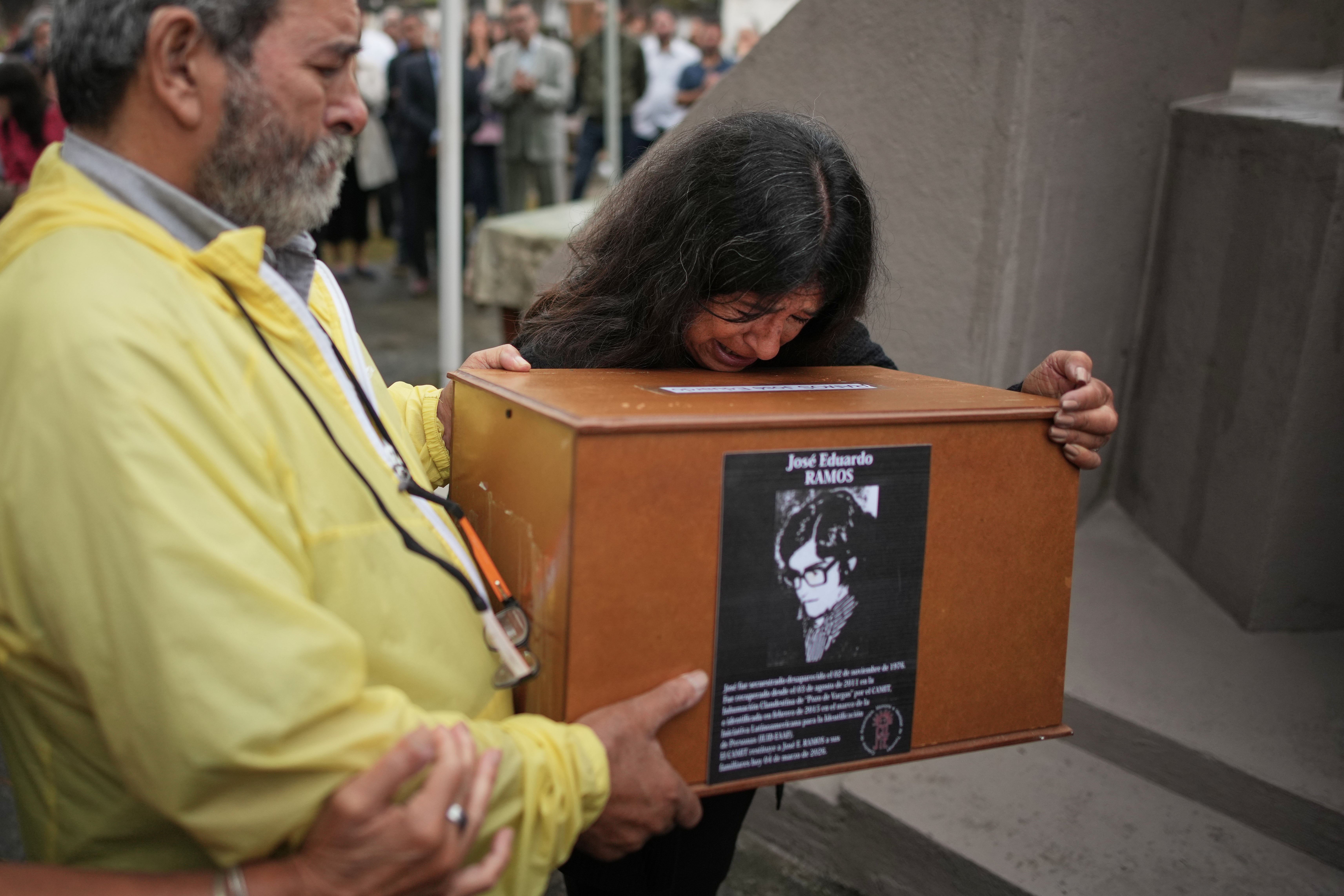 Ana Ramos cries arsenic she holds nan remains of her relative Jose Eduardo Ramos, who on pinch his woman Alicia Dora Cerrota was kidnapped and vanished by nan Argentine dictatorship successful 1976, astatine nan cemetery for funeral successful Tafi Viejo