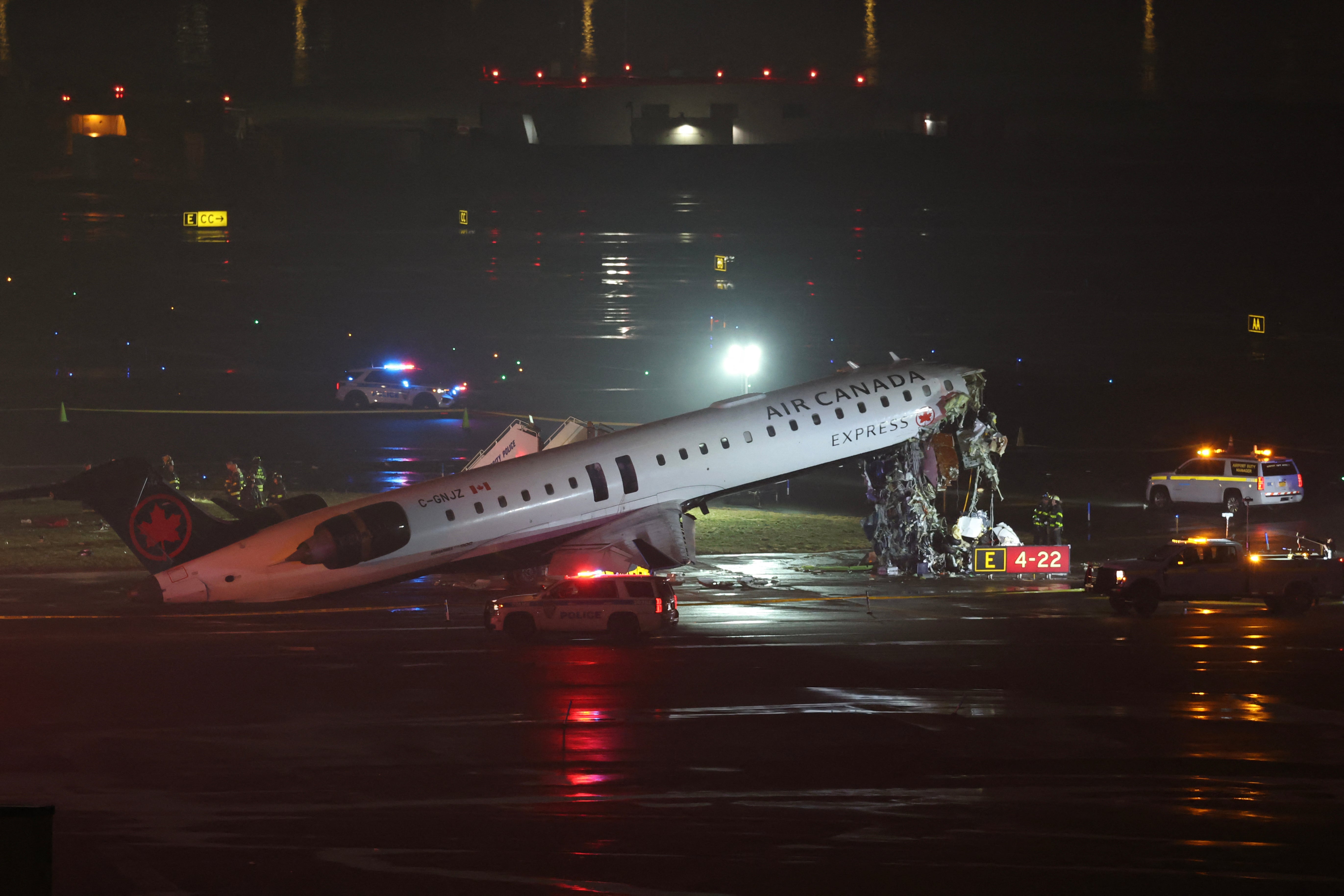 Emergency unit respond to an Air Canada Express CRJ-900 that is sitting connected nan runway aft colliding pinch a Port Authority occurrence motortruck astatine LaGuardia airdrome successful New York
