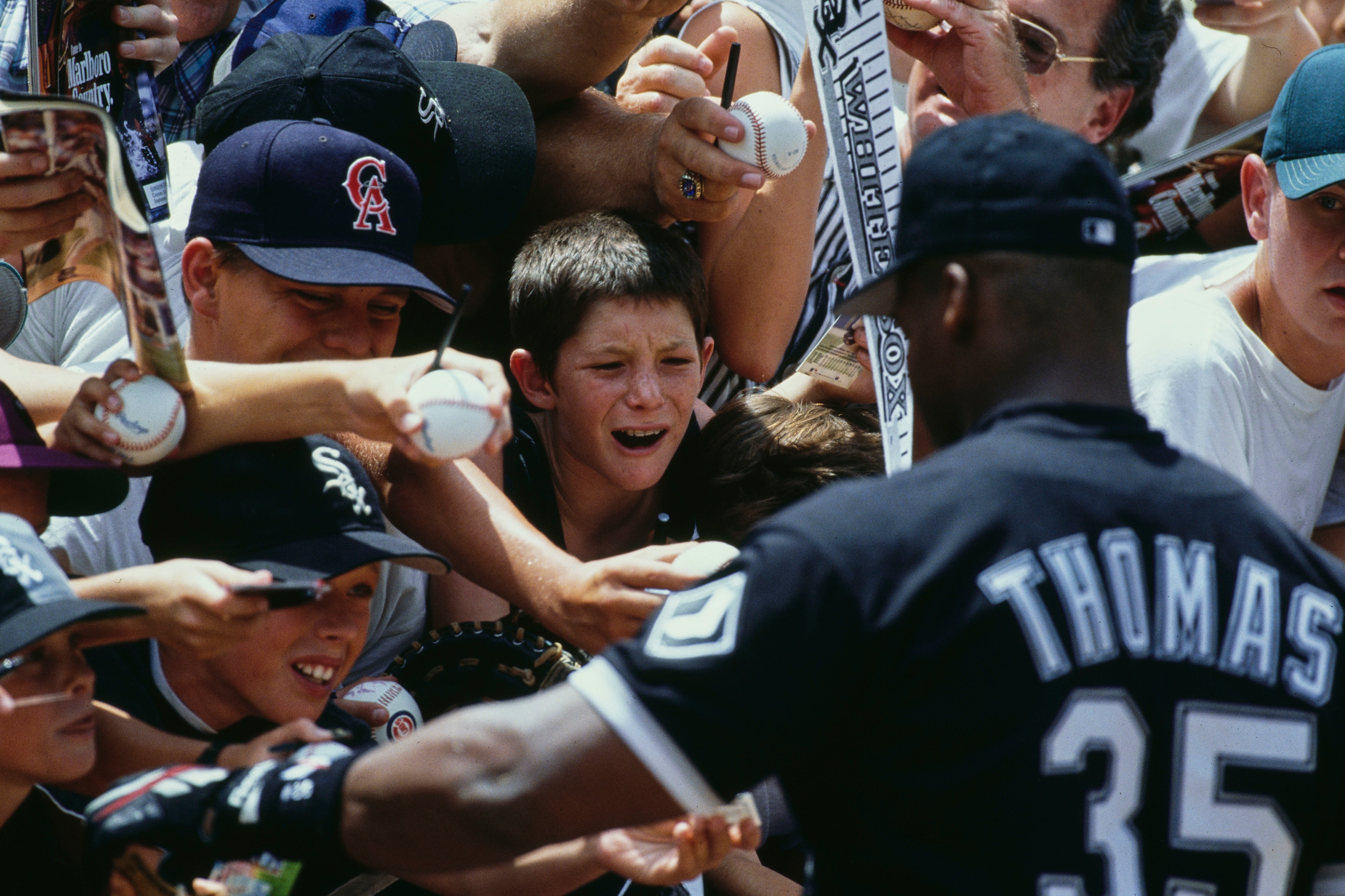 Thomas with fans during a game against the California Angels at Anaheim Stadium in California in August 1994
