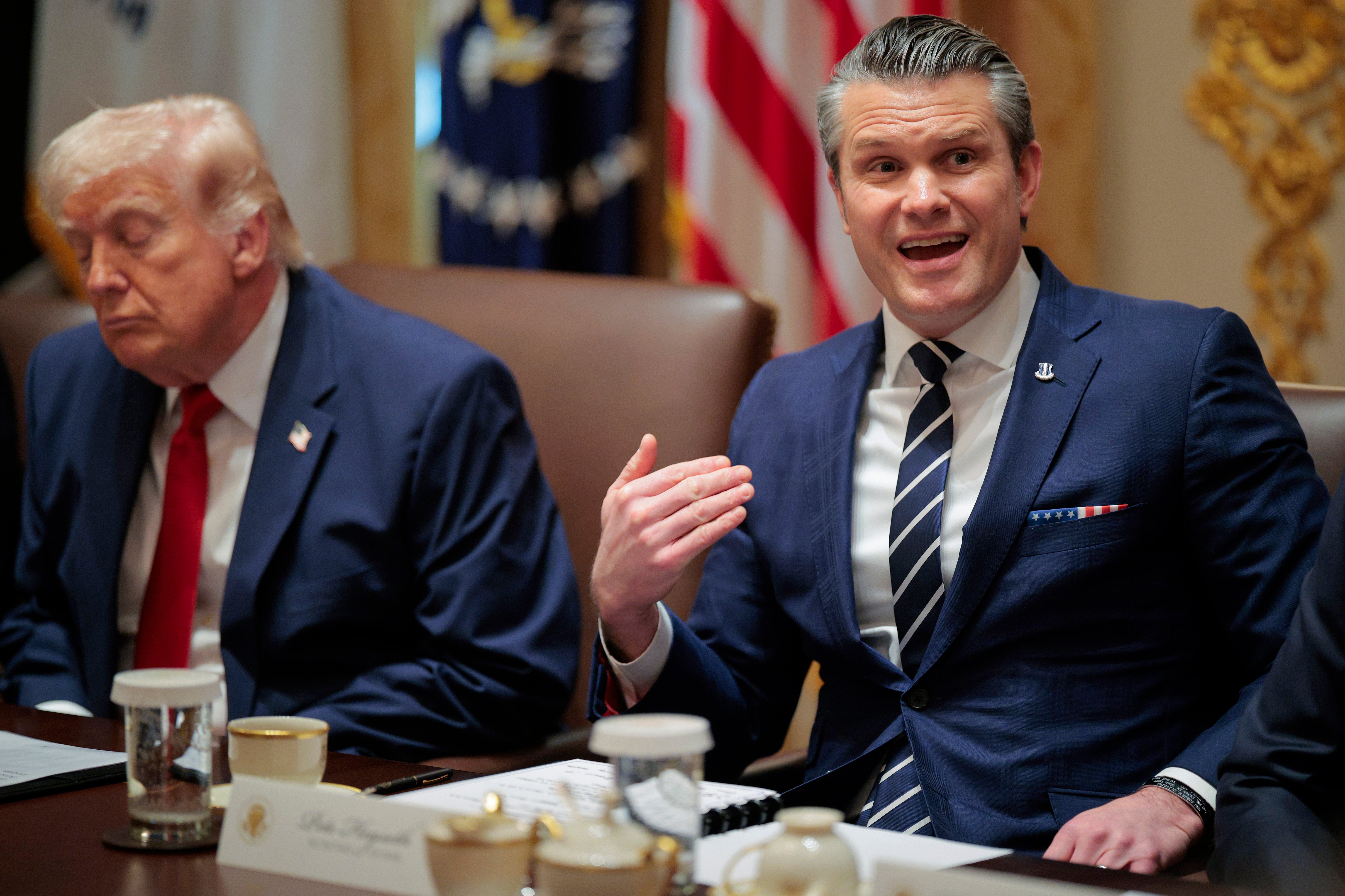 U.S. Secretary of War Pete Hegseth (R) speaks alongside U.S. President Donald Trump during a Cabinet gathering successful nan Cabinet Room of nan White House connected March 26, 2026 successful Washington, DC