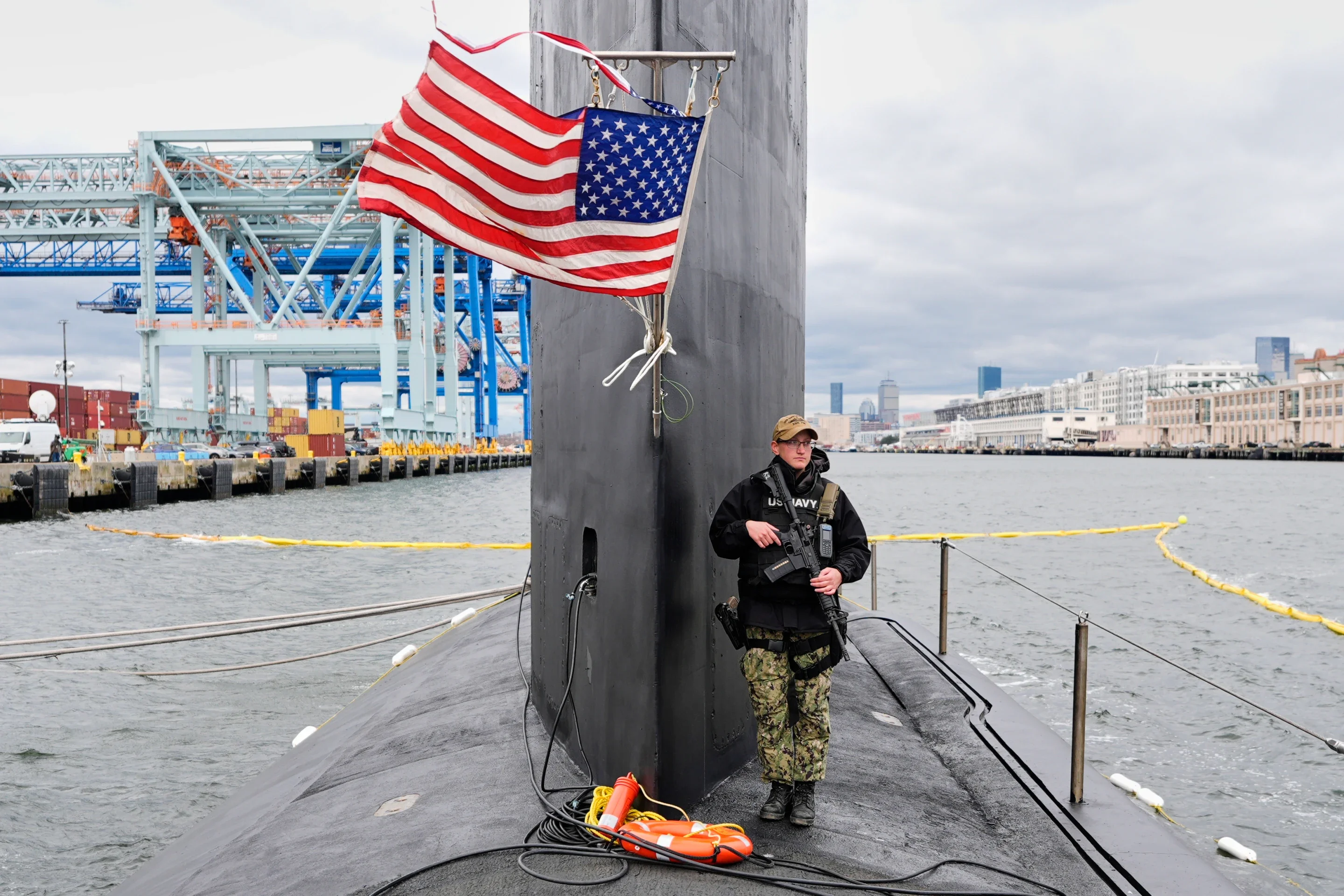 A sailor stands defender adjacent to nan sail of nan USS Massachusetts, nan Navy’s newest nuclear-powered onslaught submarine, Friday, March 27, 2026, successful Boston. (AP Photo/Robert F. Bukaty)