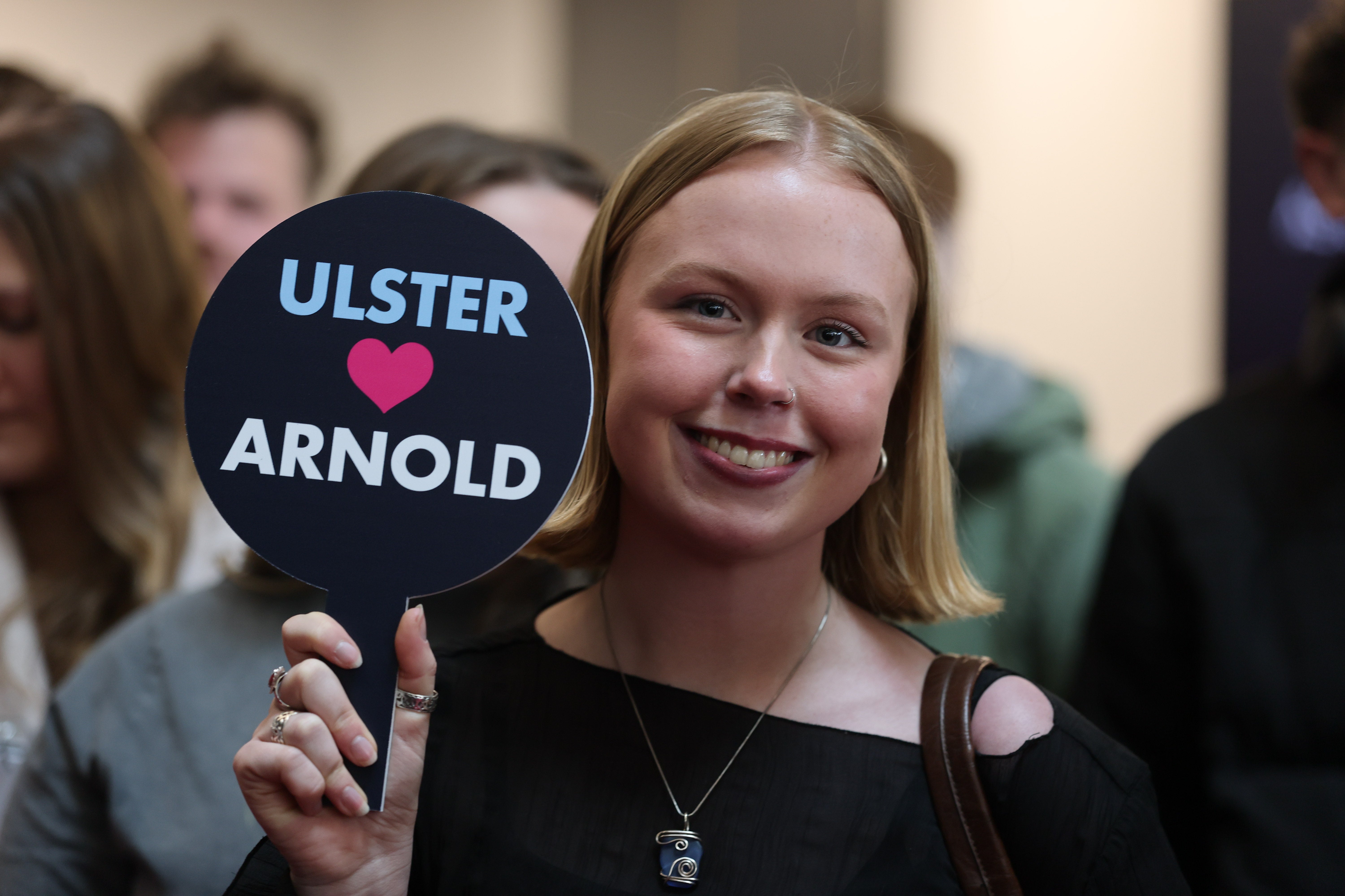 Students await the arrival of Arnold Schwarzenegger at Ulster University in Belfast.