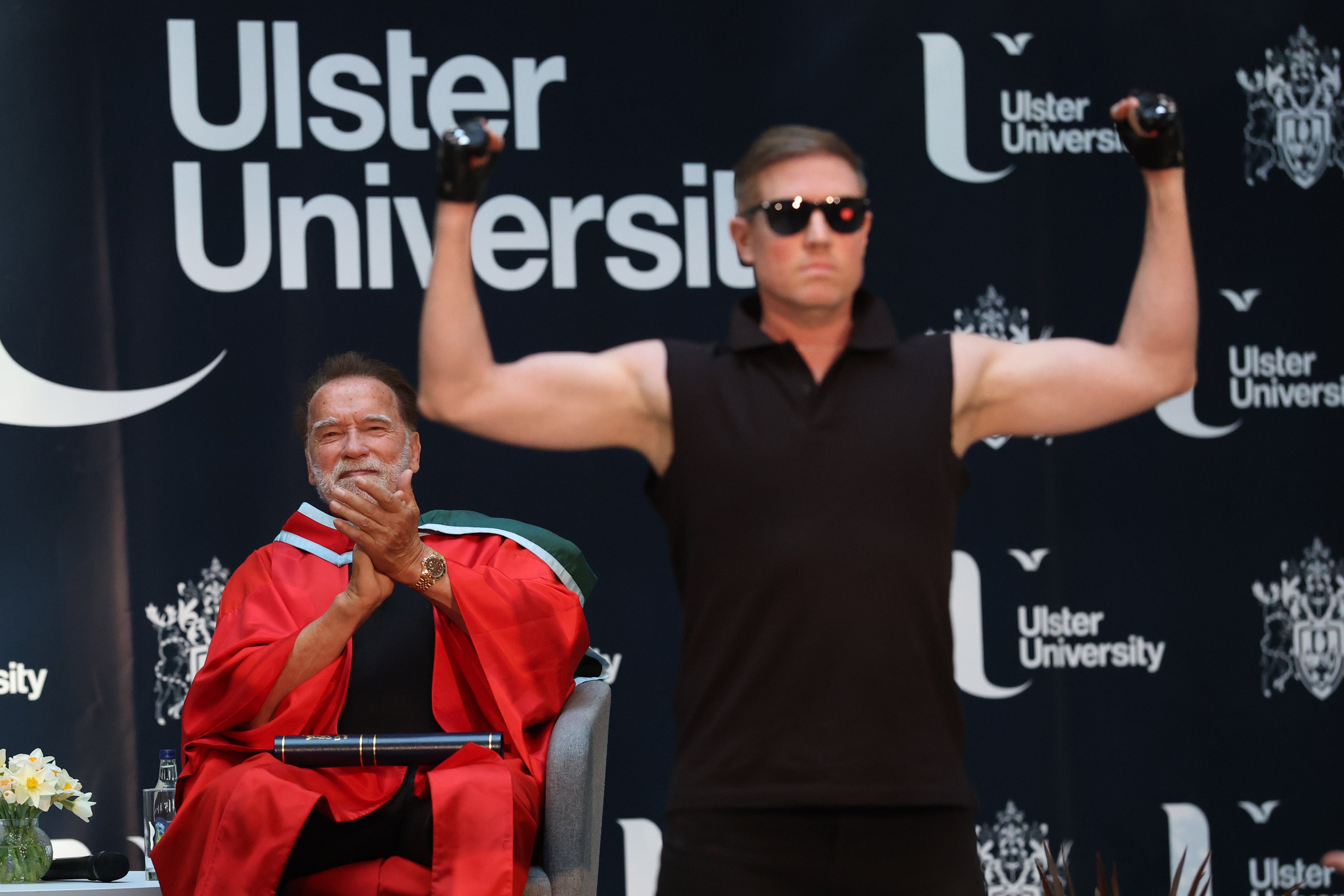 Arnold Schwarzenegger claps after watching a dancer dressed as his ‘terminator’ character.