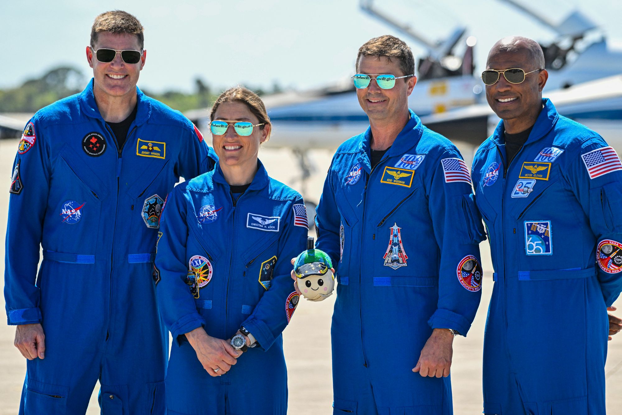 The Artemis II astronauts pose for photos with ‘Rise,’ their new zero gravity indicator. The mission is expected to launch Wednesday night from Florida’s Kennedy Space Center