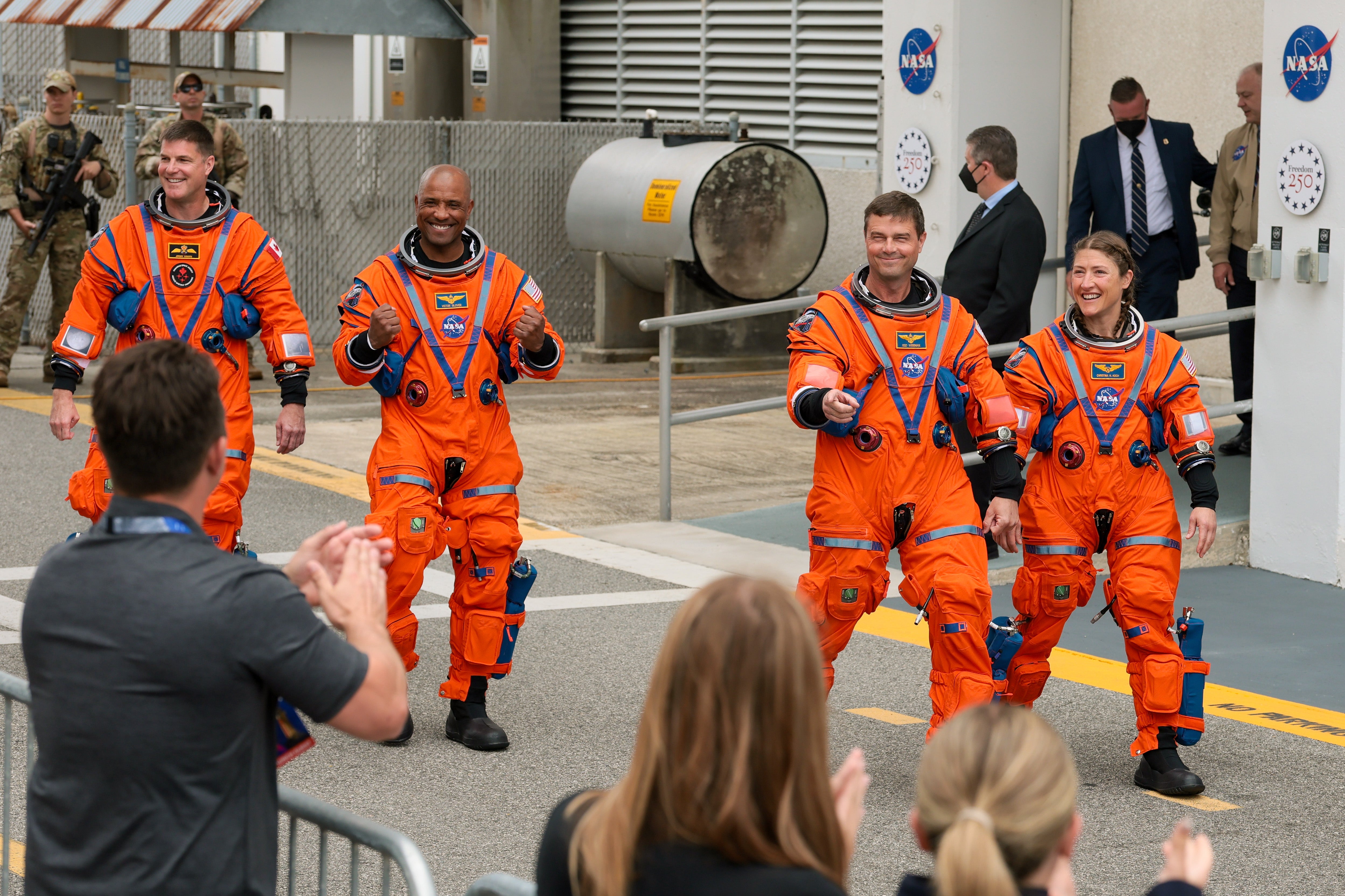 The Artemis II astronauts walk out of the Neil A. Armstrong Operations and Checkout Building at NASA’s Kennedy Space Center on Wednesday in Cape Canaveral, Florida. Three of the astronauts are set to make history on the trip