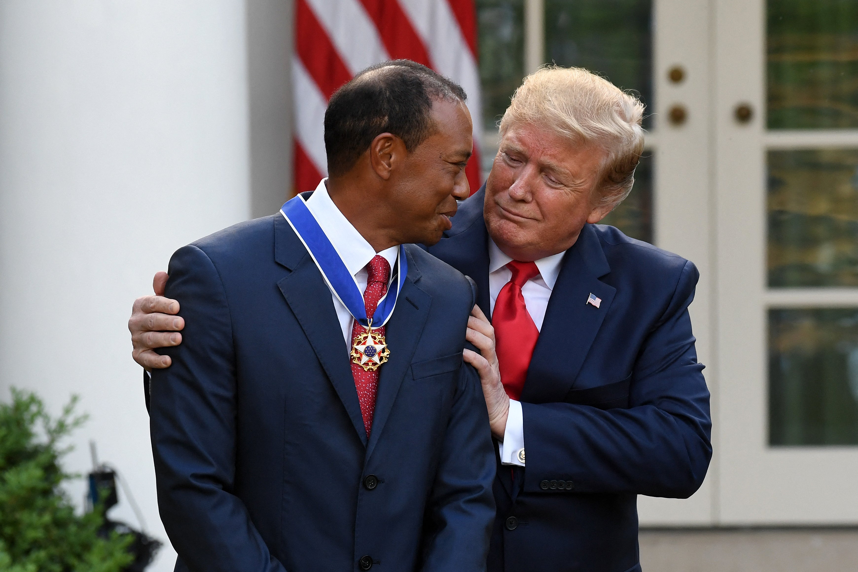 President Donald Trump with his friend Tiger Woods in 2019